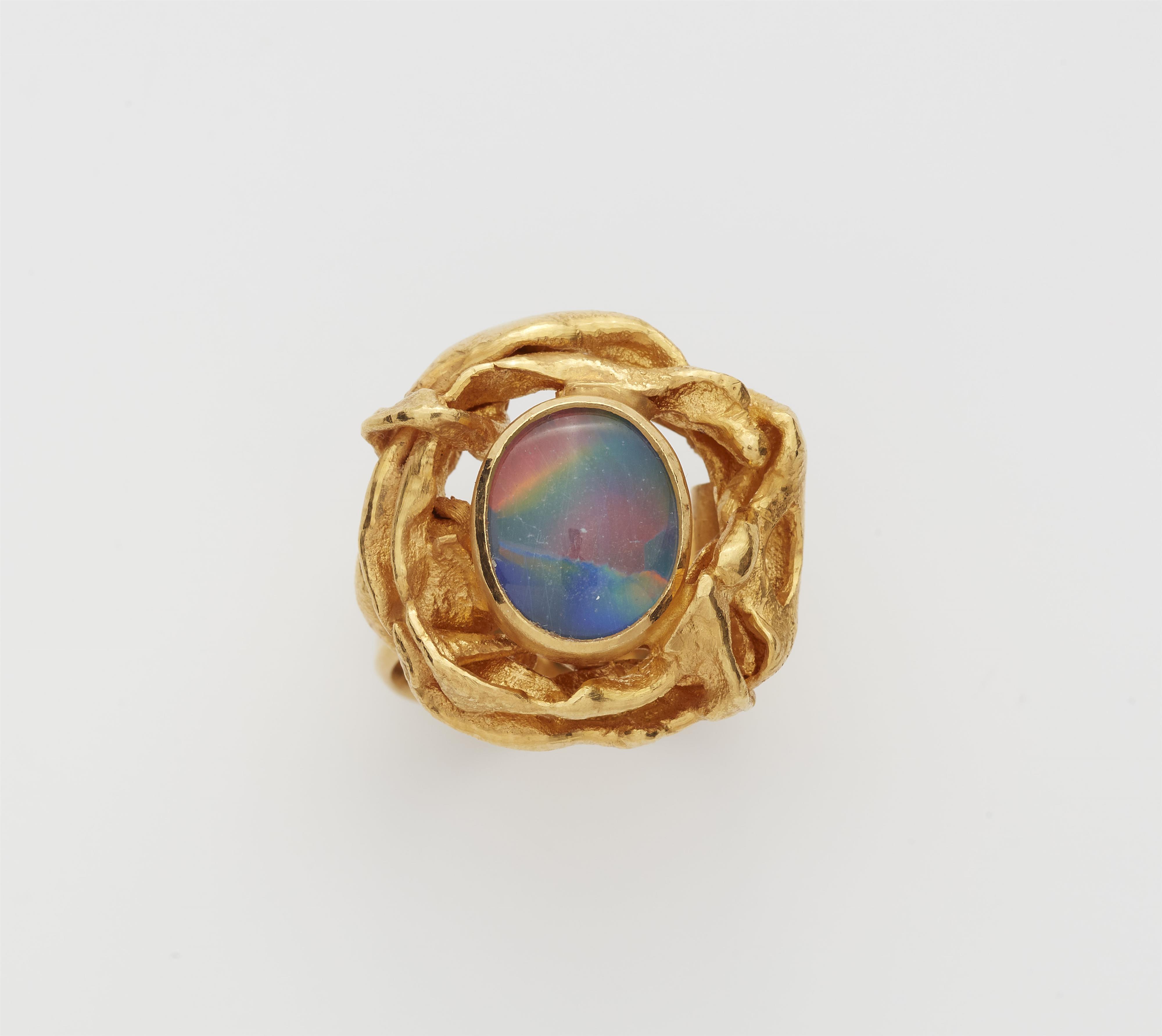 A German 18k gold and harlekin opal triplet ring. - image-1