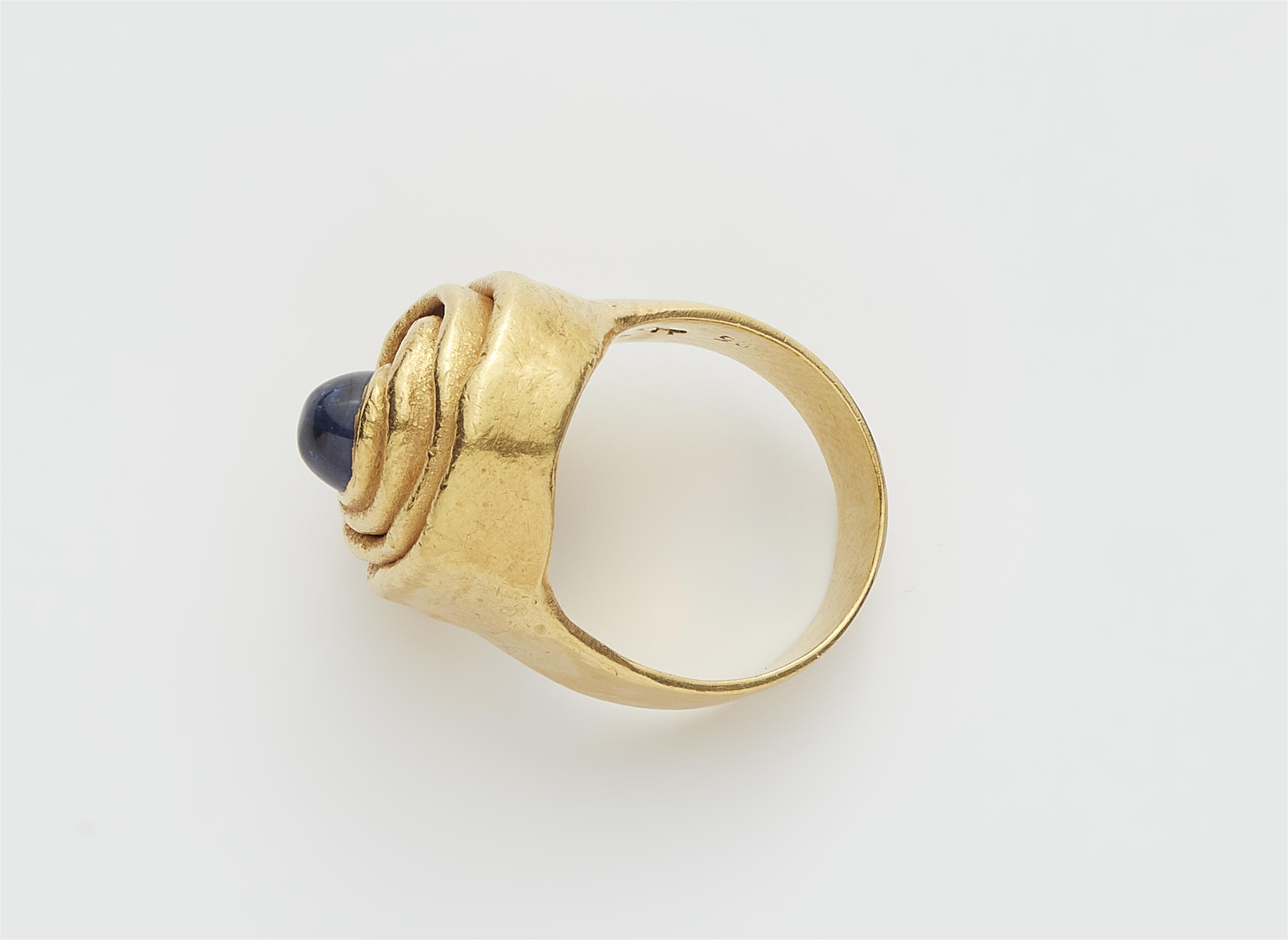 A German forged 21k gold and sapphire cabochon ring. - image-2
