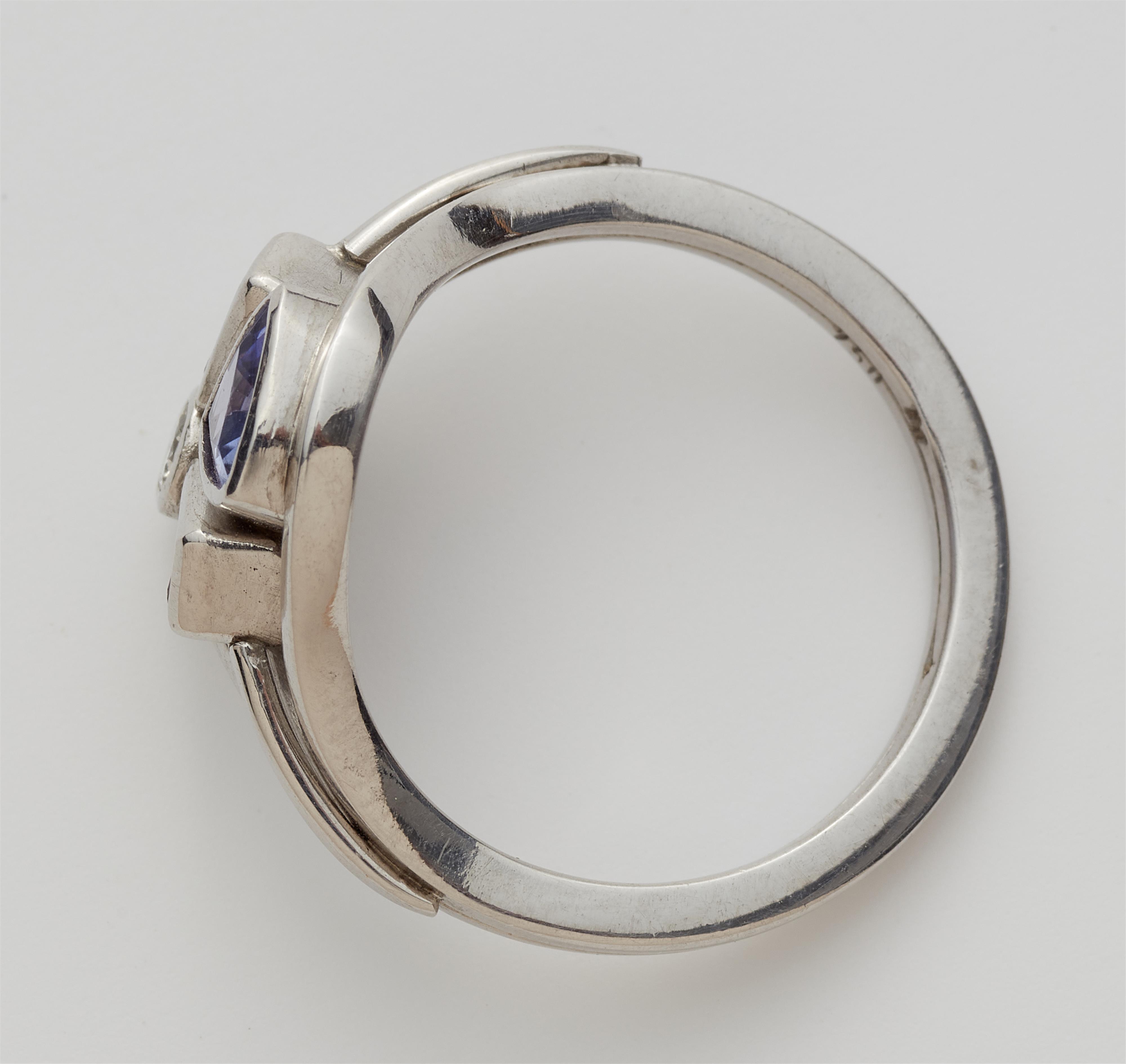 A German 18k white gold tanzanite, ruby and diamond ring. - image-2