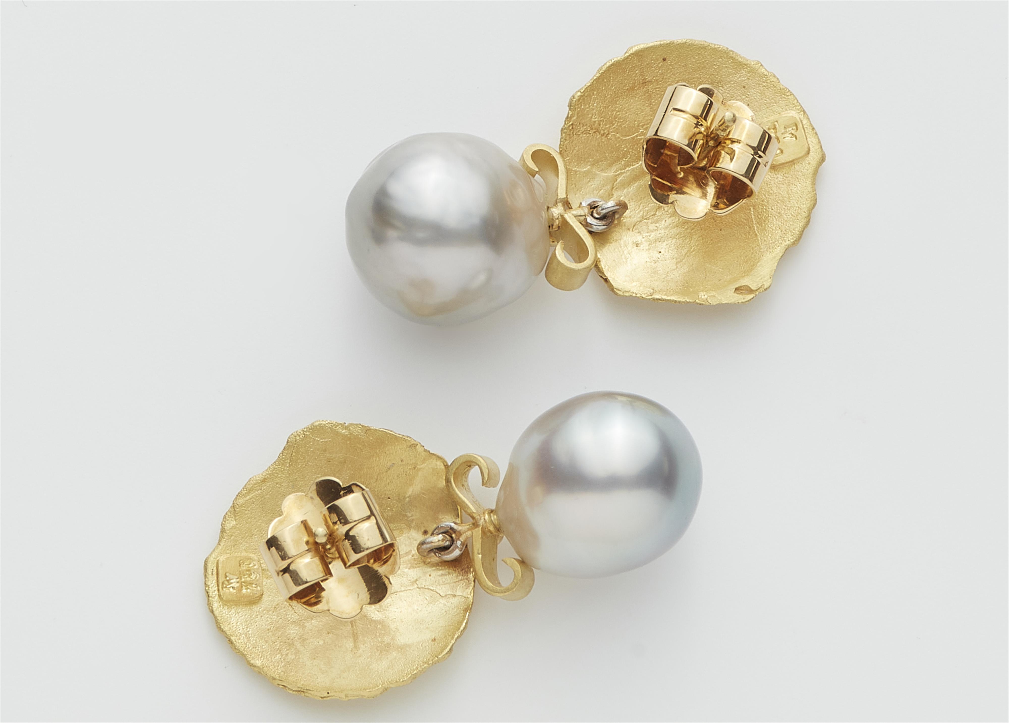 A pair of German 18k gold shell cast and grey baroque Tahiti cultured pearl drop earrings. - image-2