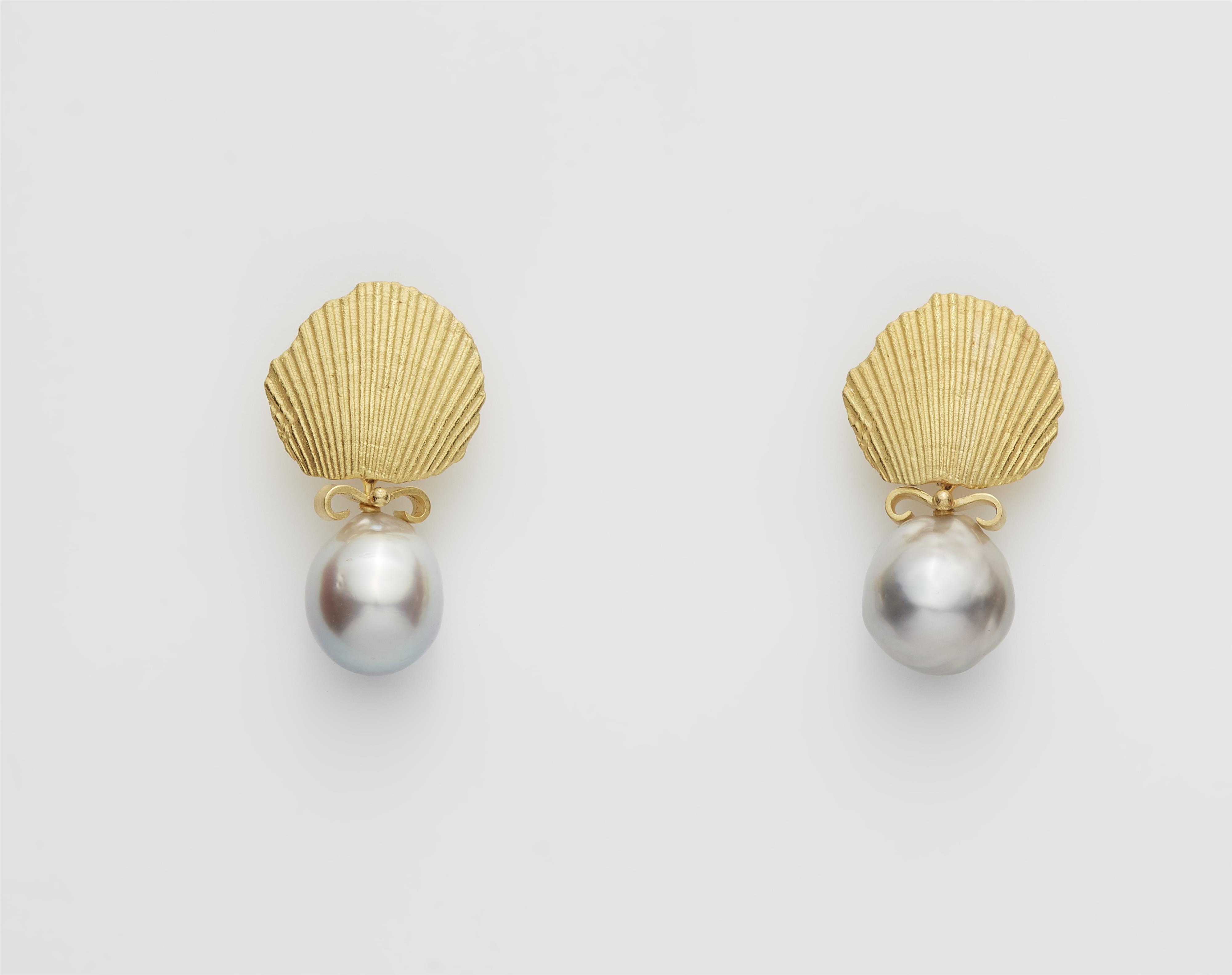 A pair of German 18k gold shell cast and grey baroque Tahiti cultured pearl drop earrings. - image-1