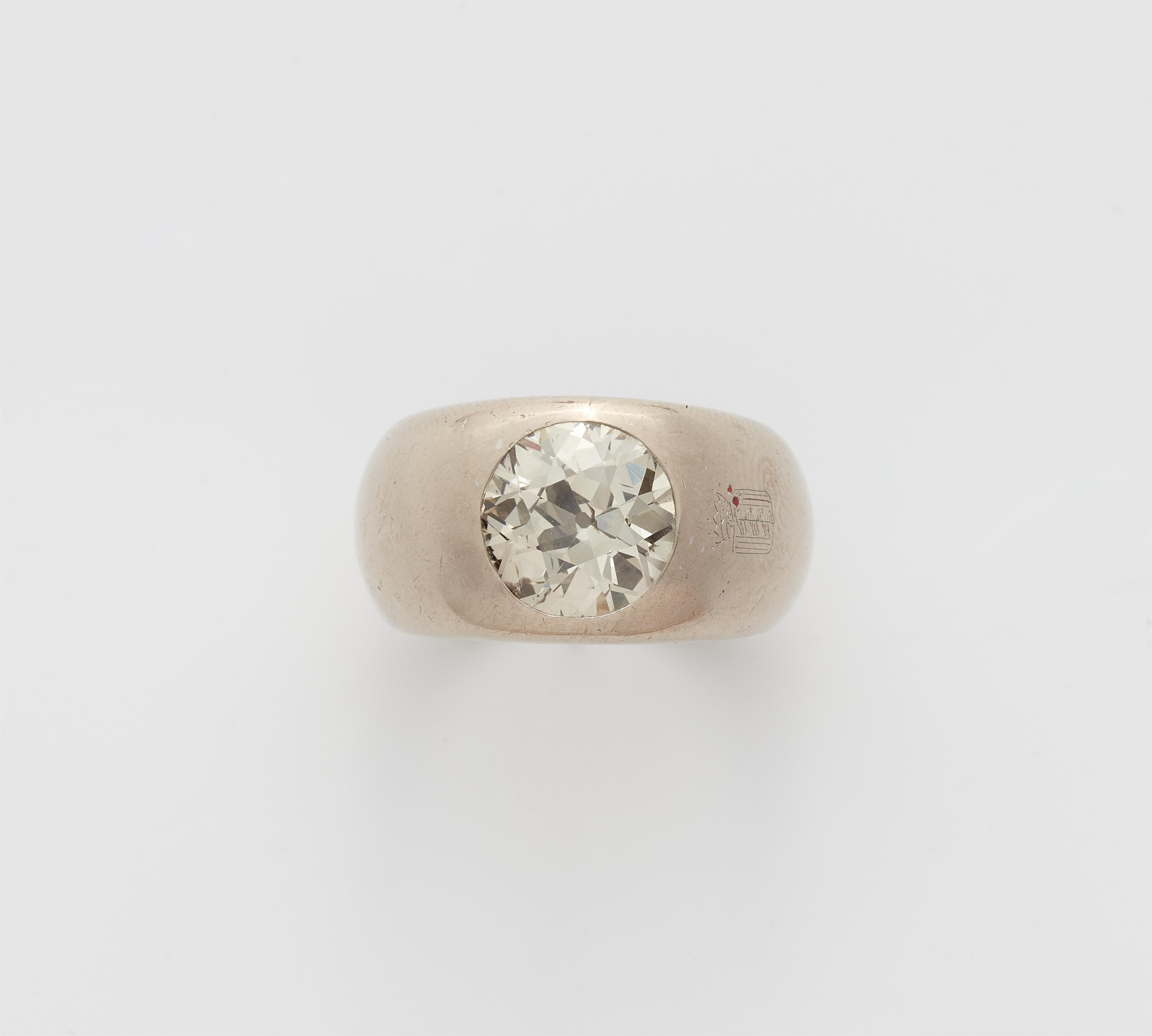 An 18k gold and brownish European old-cut diamond solitaire ring. - image-1