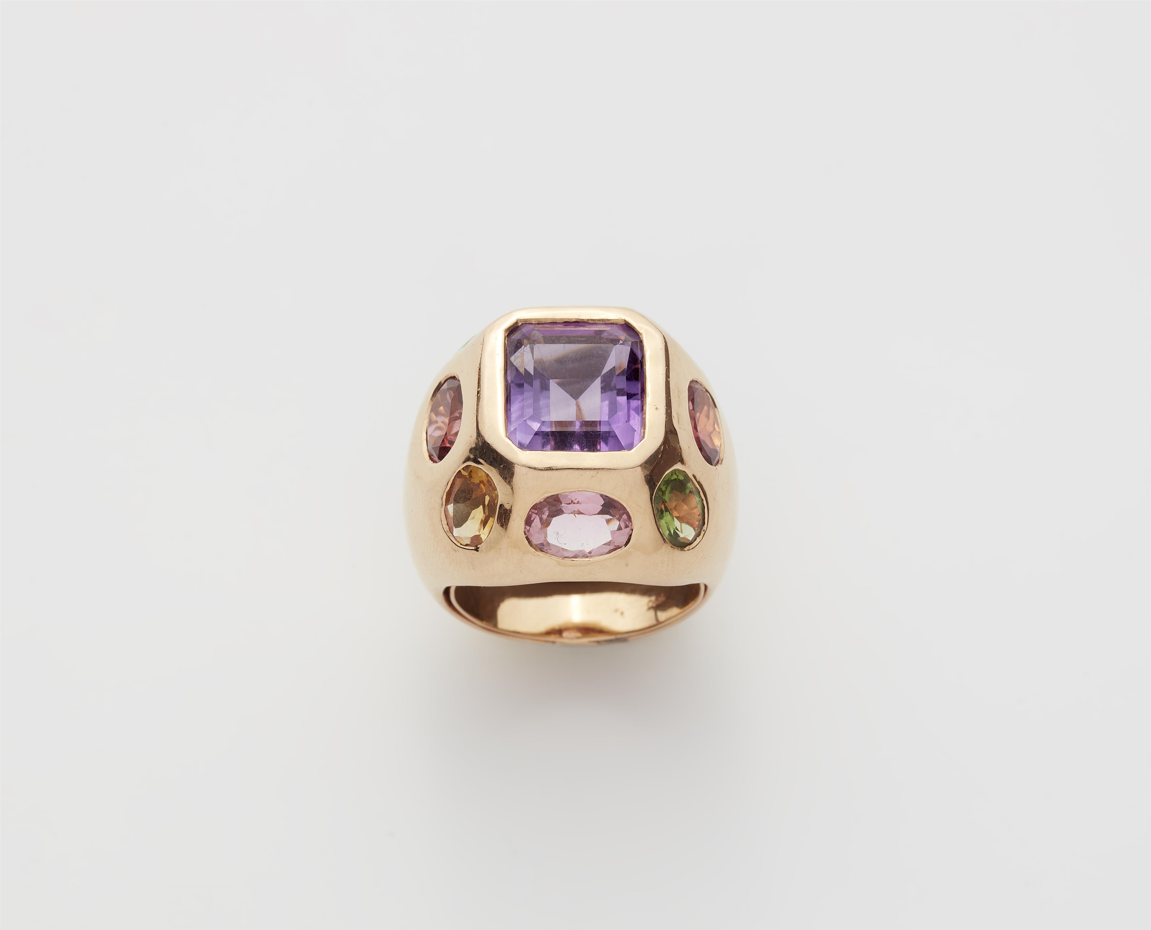 An 18k rose gold domed Chanel style cocktail ring with coloured gemstones. - image-1