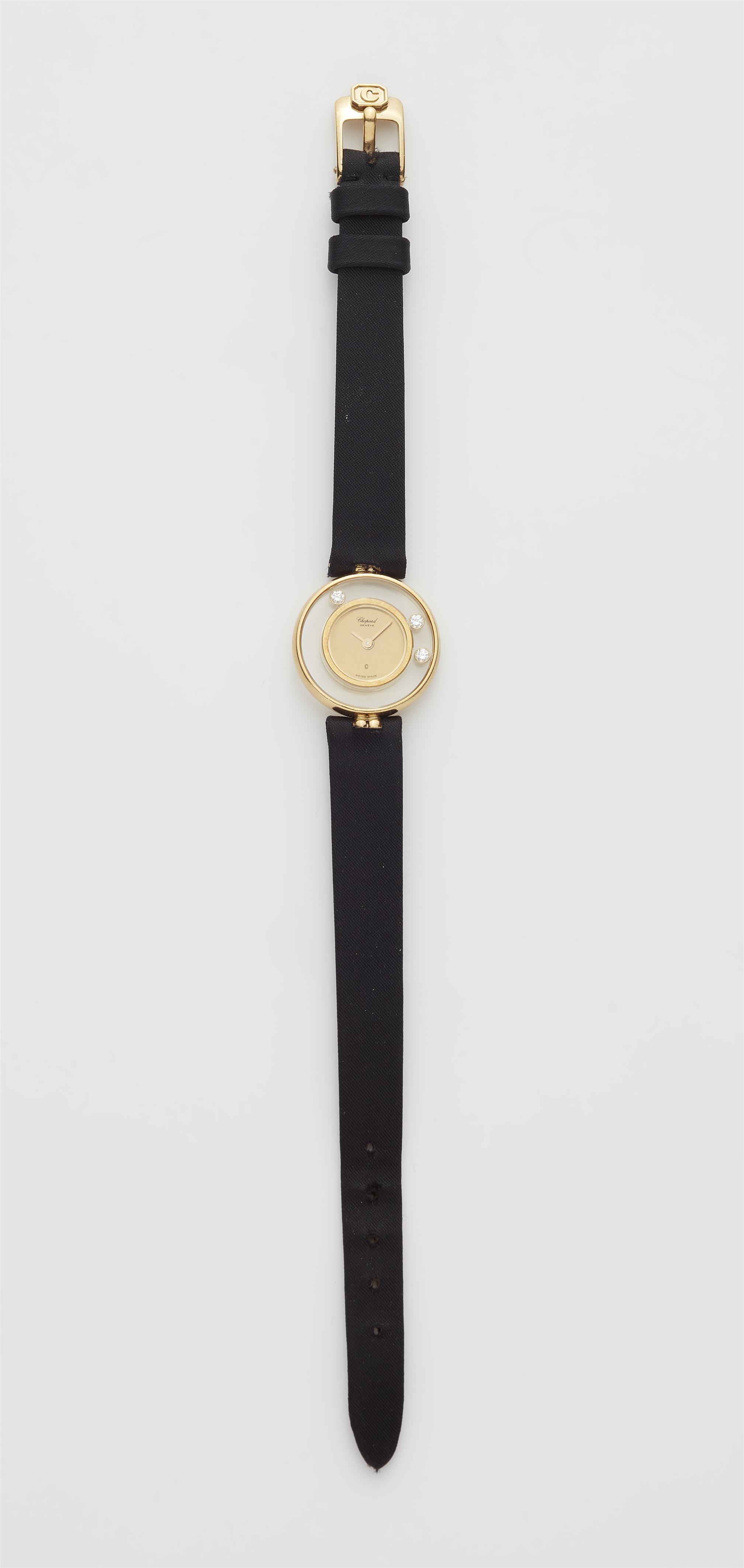 An 18k yellow gold Chopard Happy Diamonds ladies wristwatch. - image-1