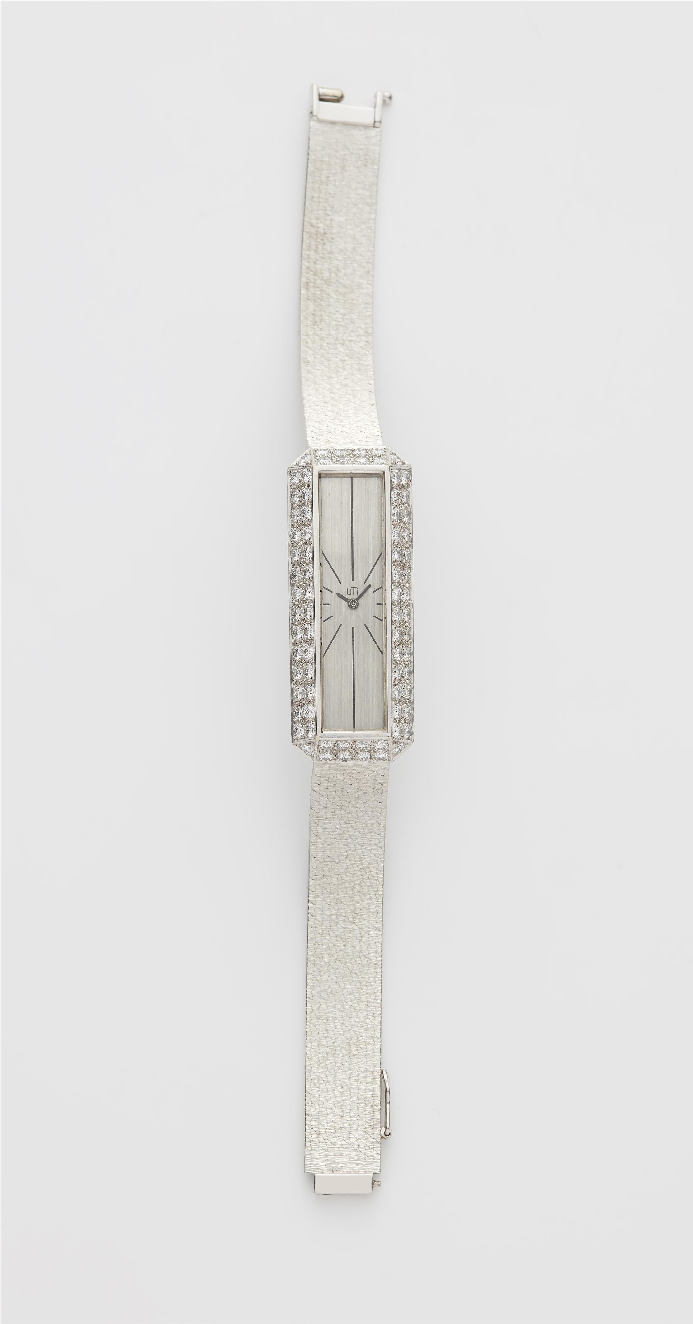 An 18k white gold and diamond manually wound Utinam ladies wristwatch. - image-1
