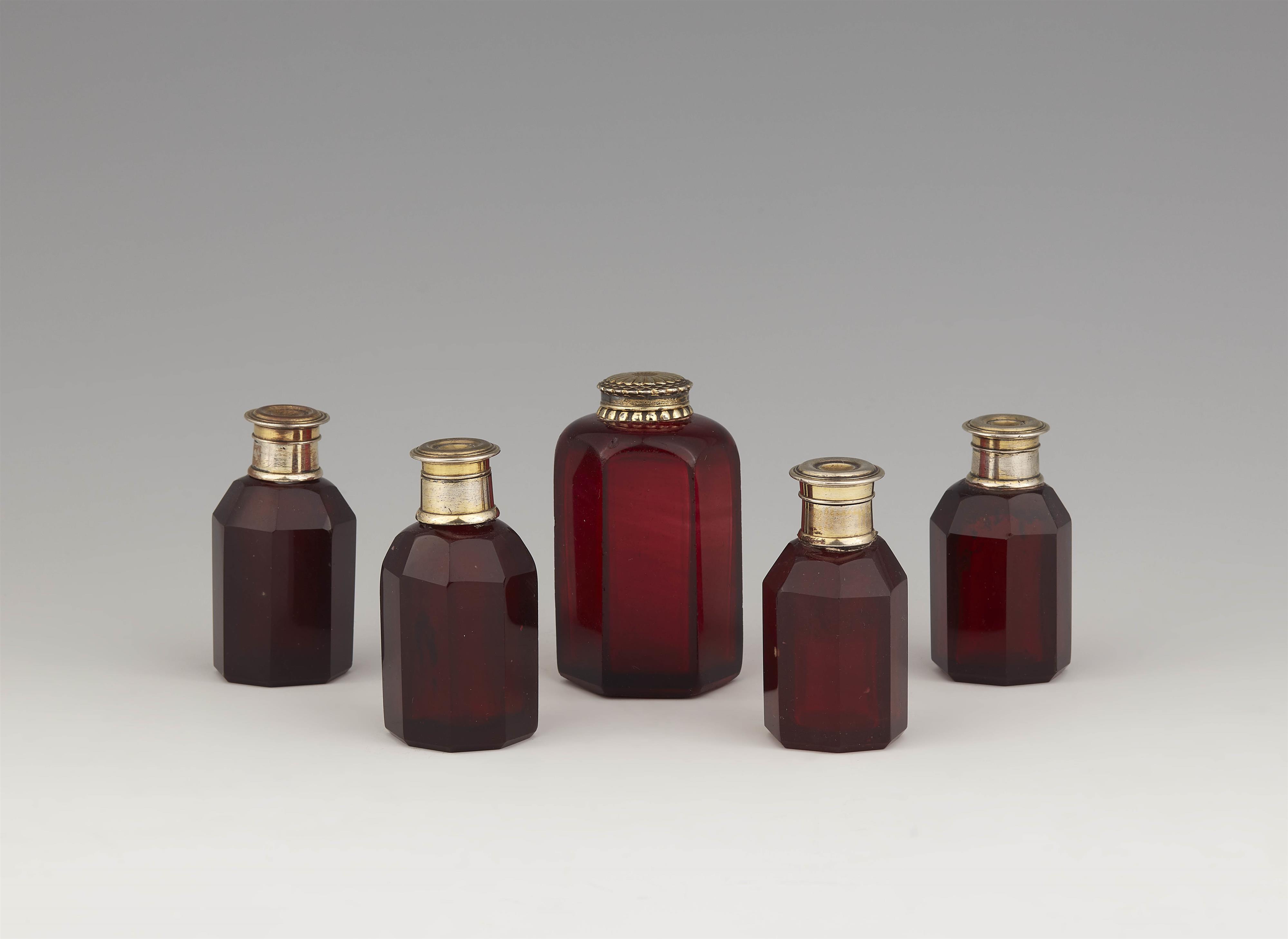 Five vermeil-mounted ruby glass bottles from a travel necessaire - image-1