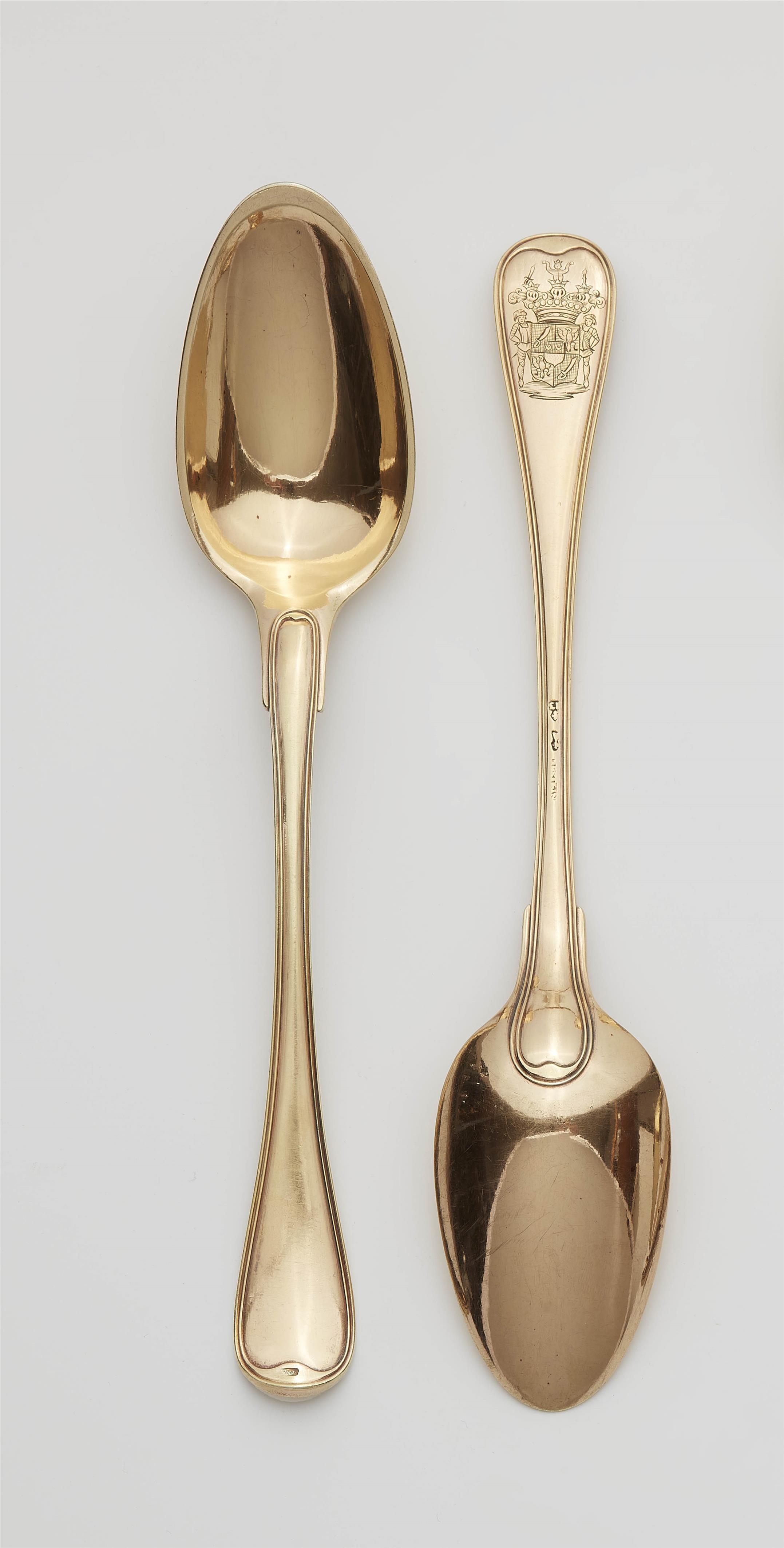 A pair of Strasbourg silver gilt serving spoons - image-1