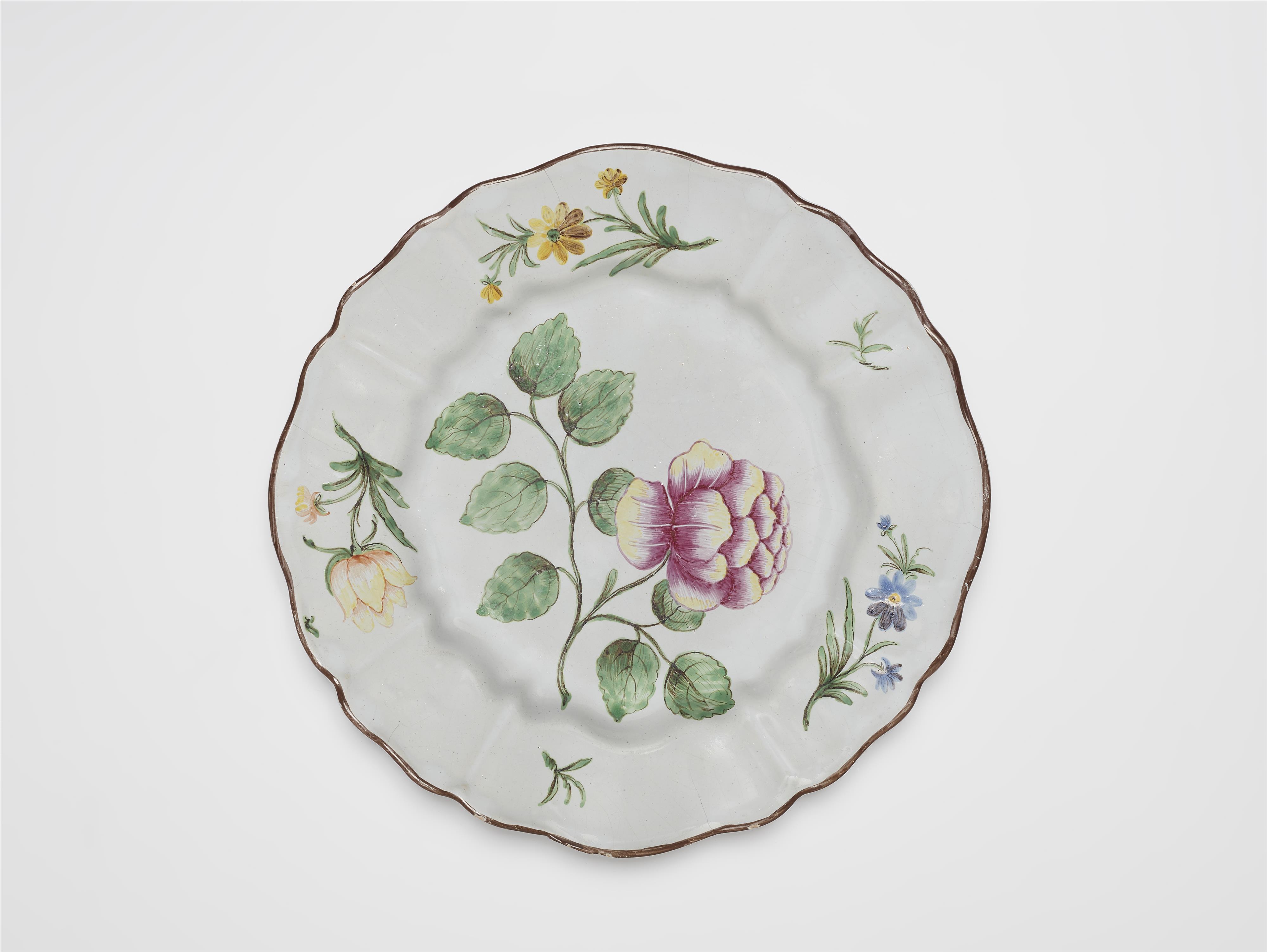 A Proskau faience plate with rose decor - image-1