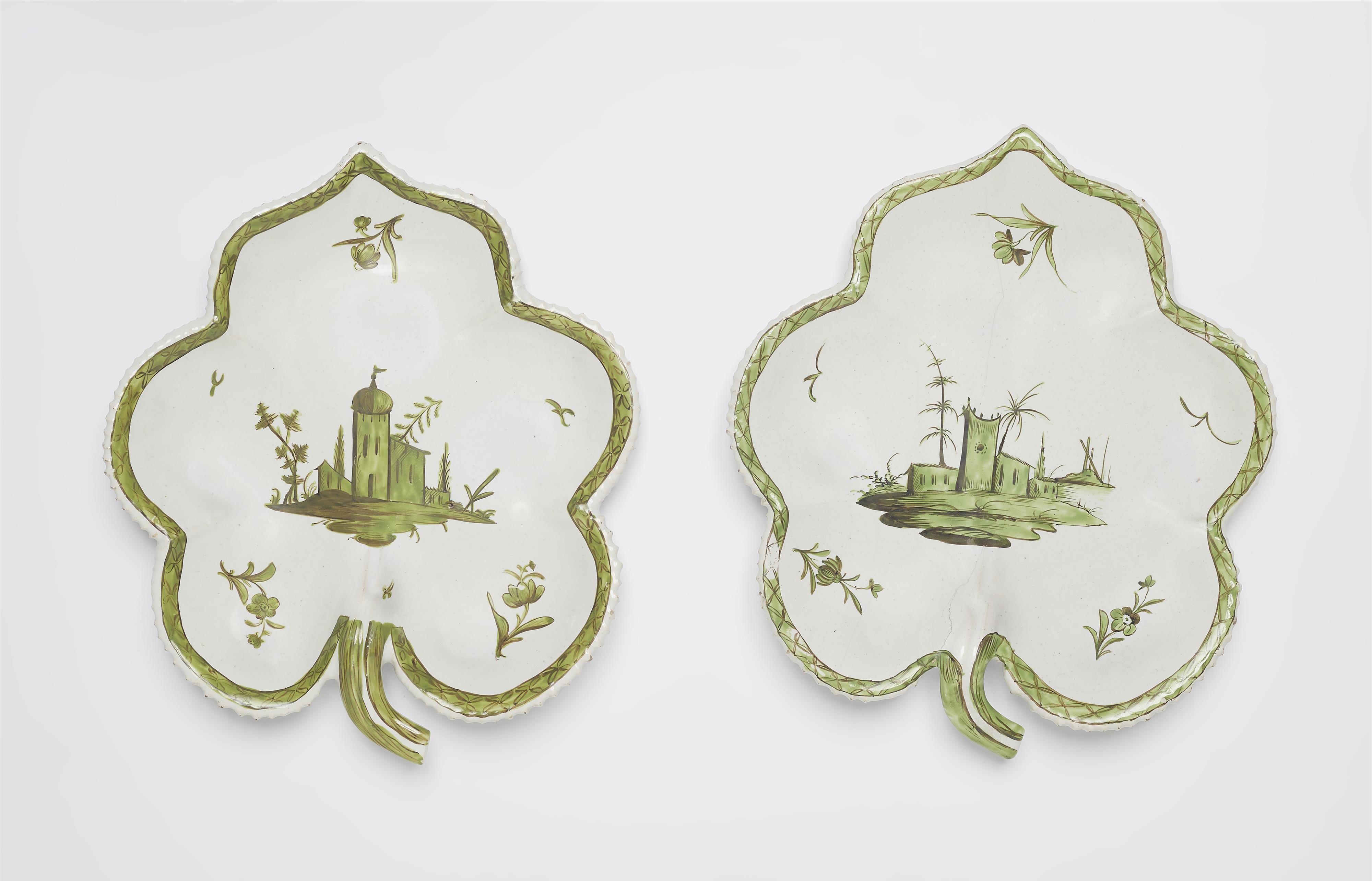 A pair of Proskau faience leaf rim dishes with architectural motifs - image-1