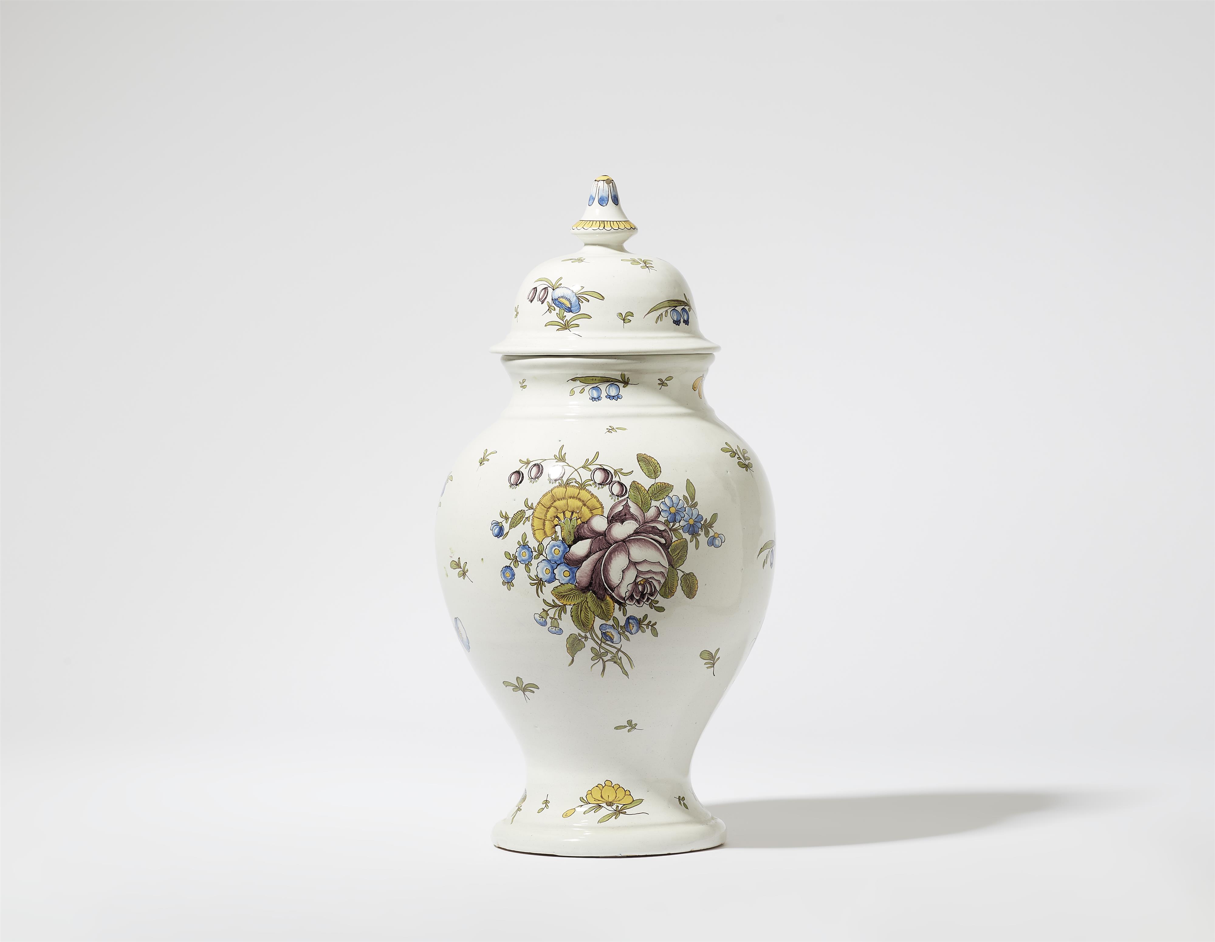 A faience vase with floral decor - image-1