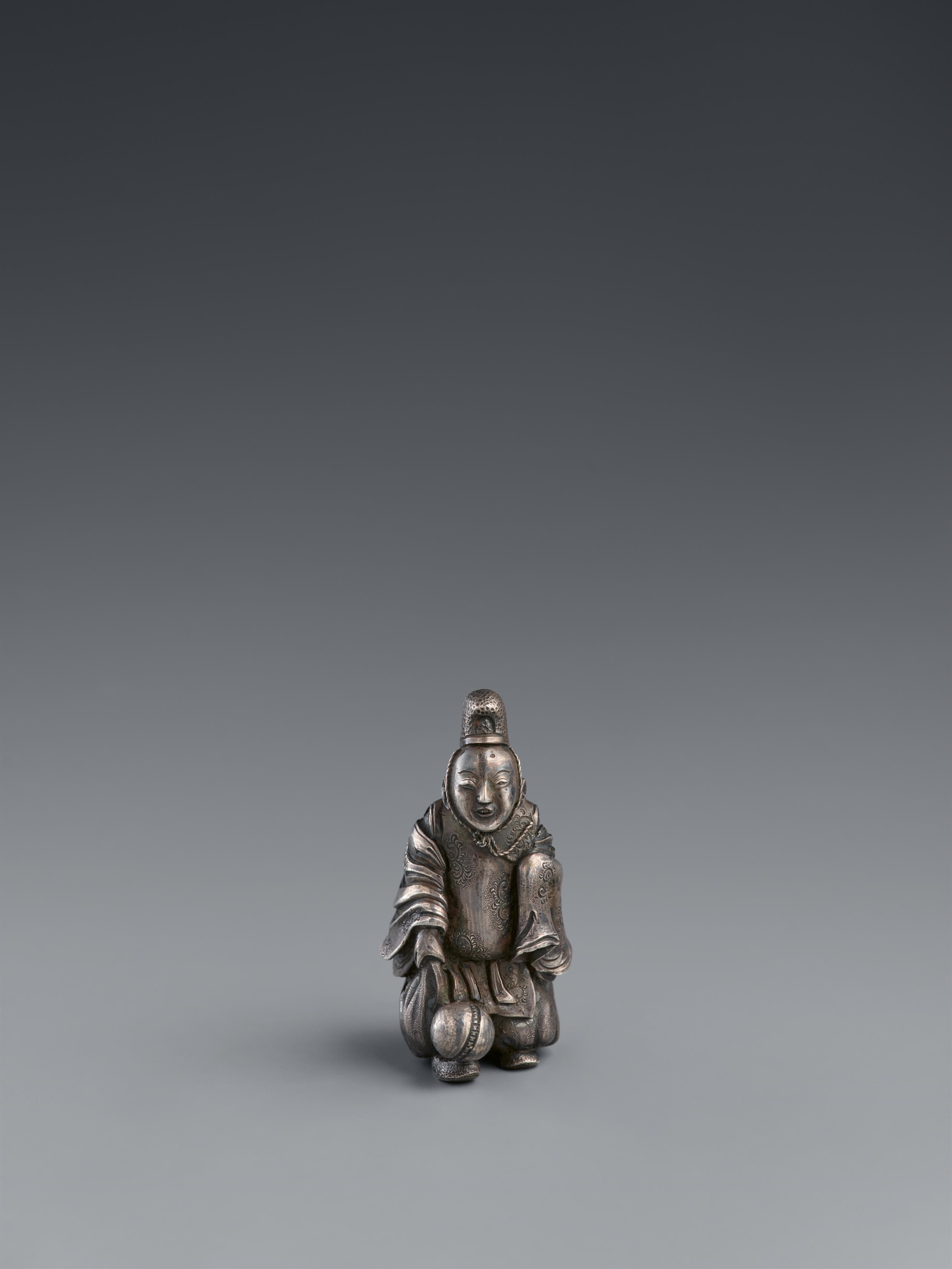 A silver netsuke of courtier playing foot ball. 19th century - image-1