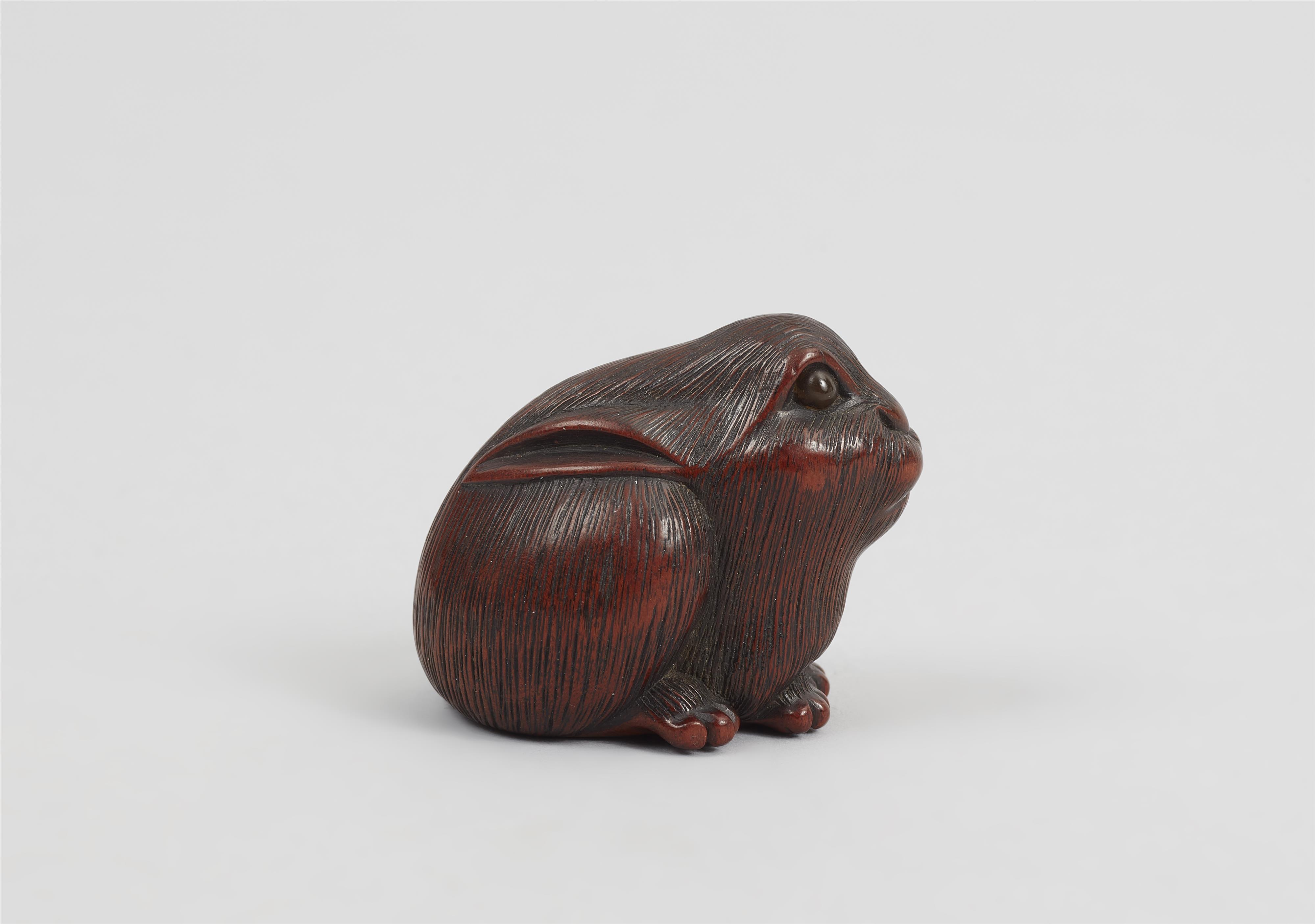 A wood netsuke of seated hare. - image-6