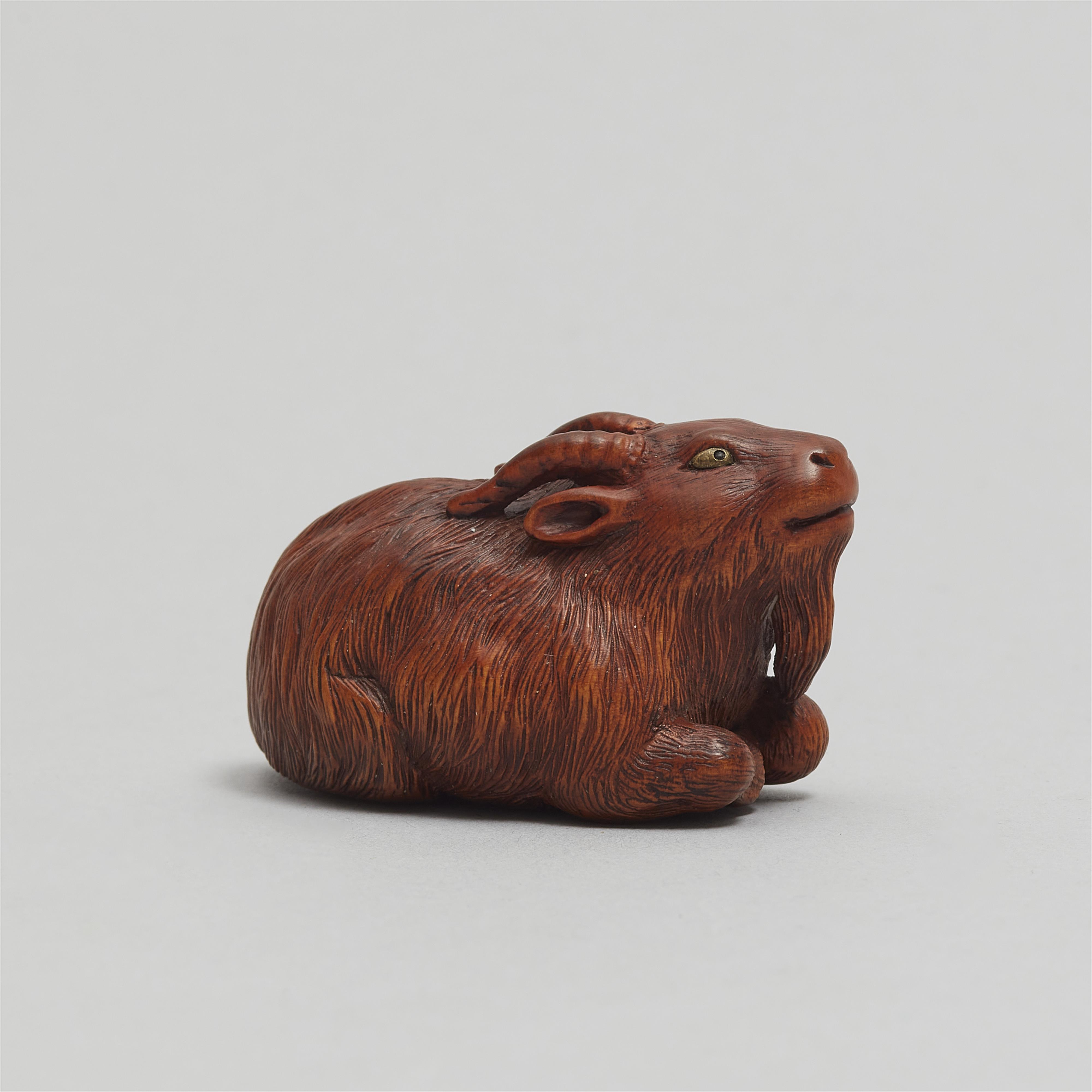 A boxwood netsuke of a reclining long-haired goat. Probably Tsu. First half 19th century - image-3