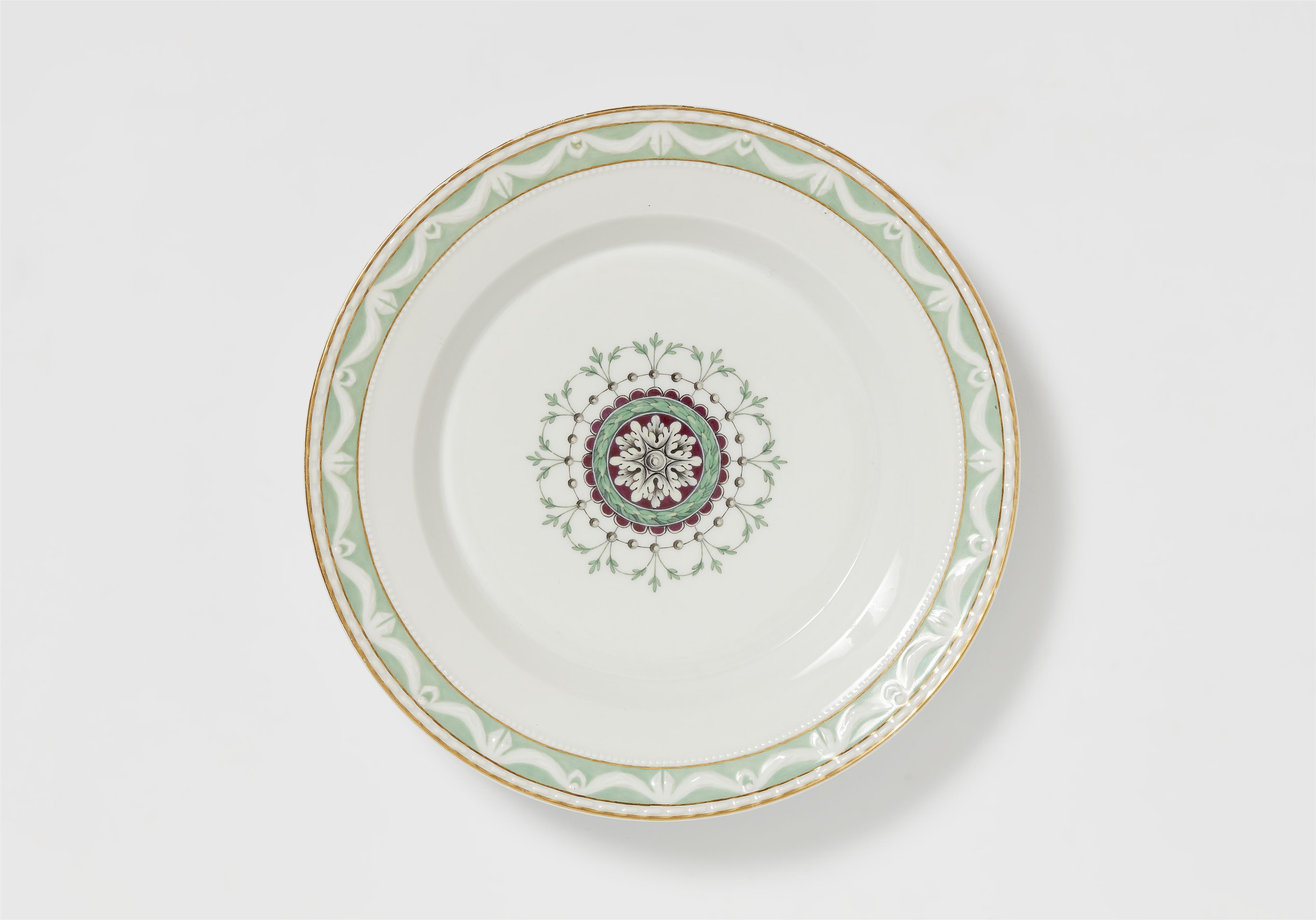 A Berlin KPM porcelain dinner plate from a service with a Neoclassical medallion motif - image-1