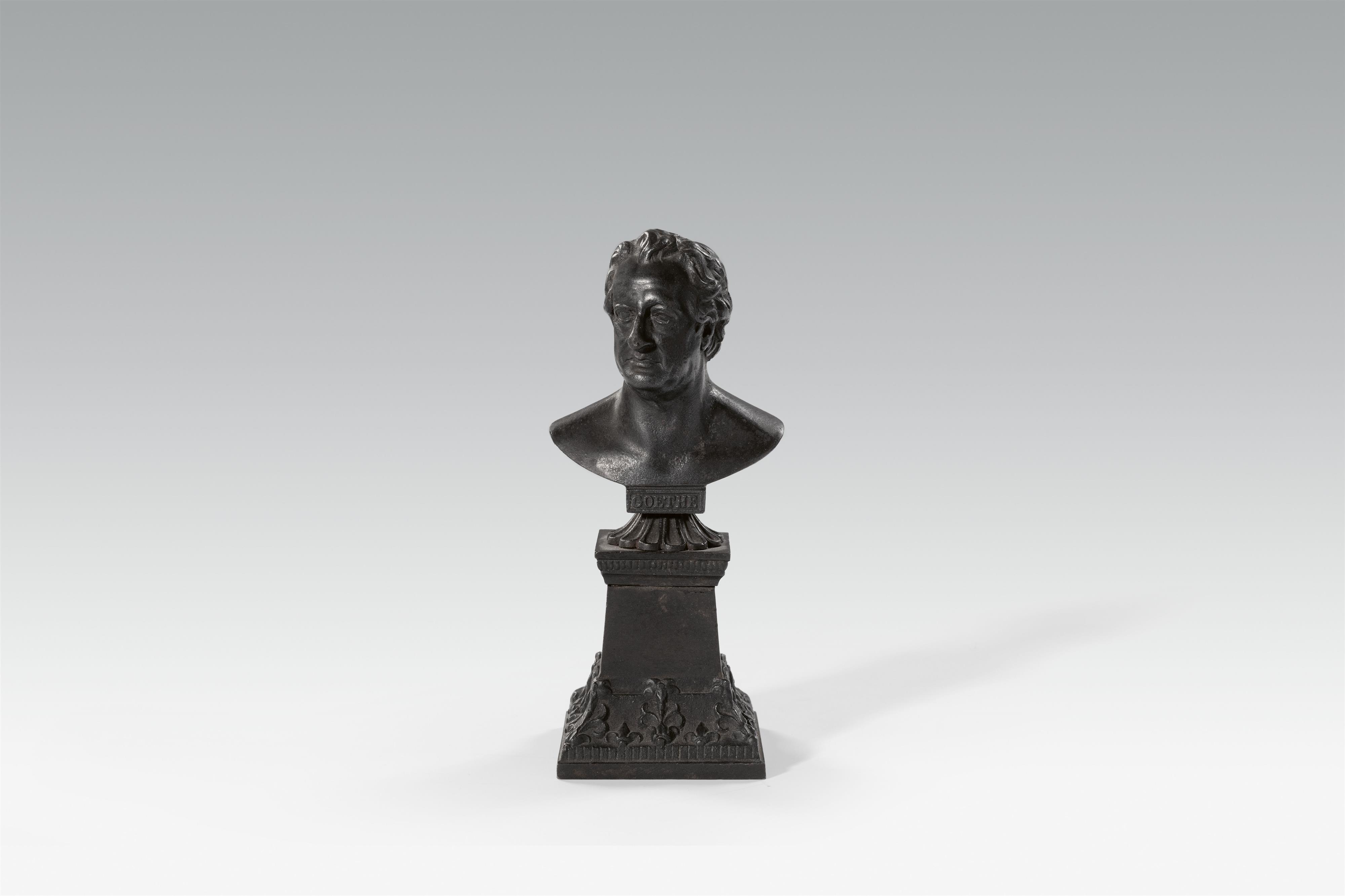 A cast iron bust of Goethe on a plinth - image-1