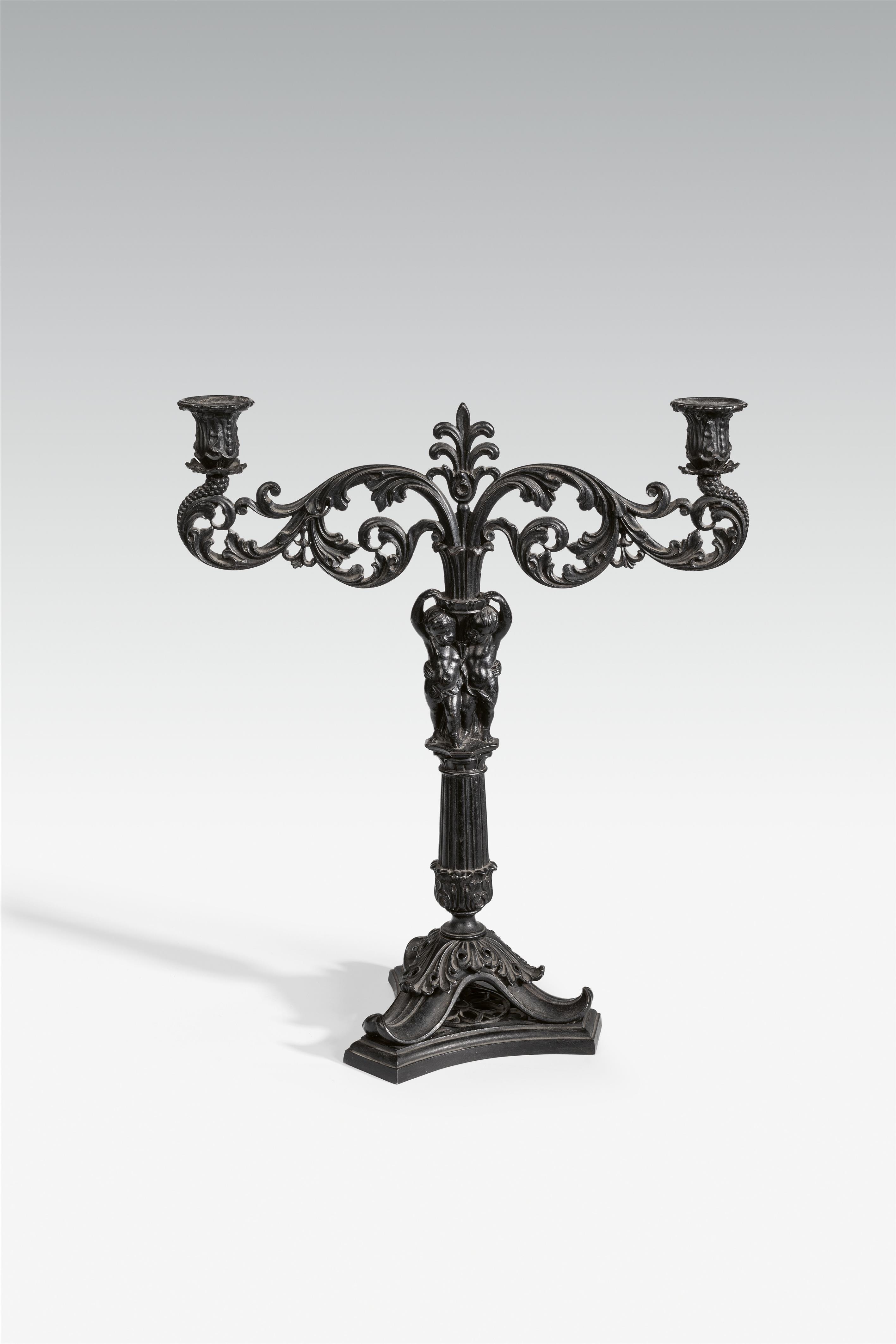 A cast iron candlestick - image-1