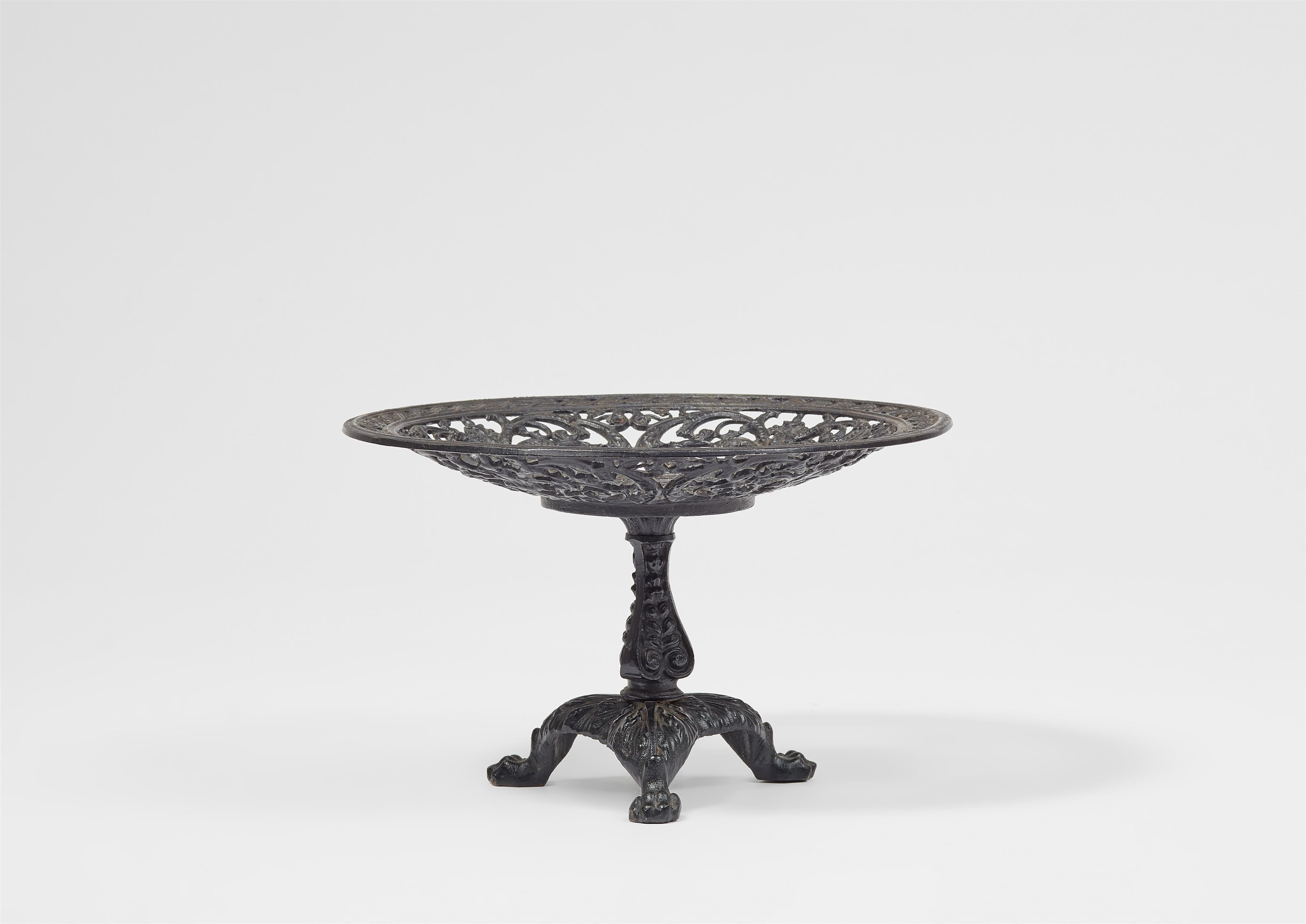 A cast iron stembowl with arabesque decor - image-2