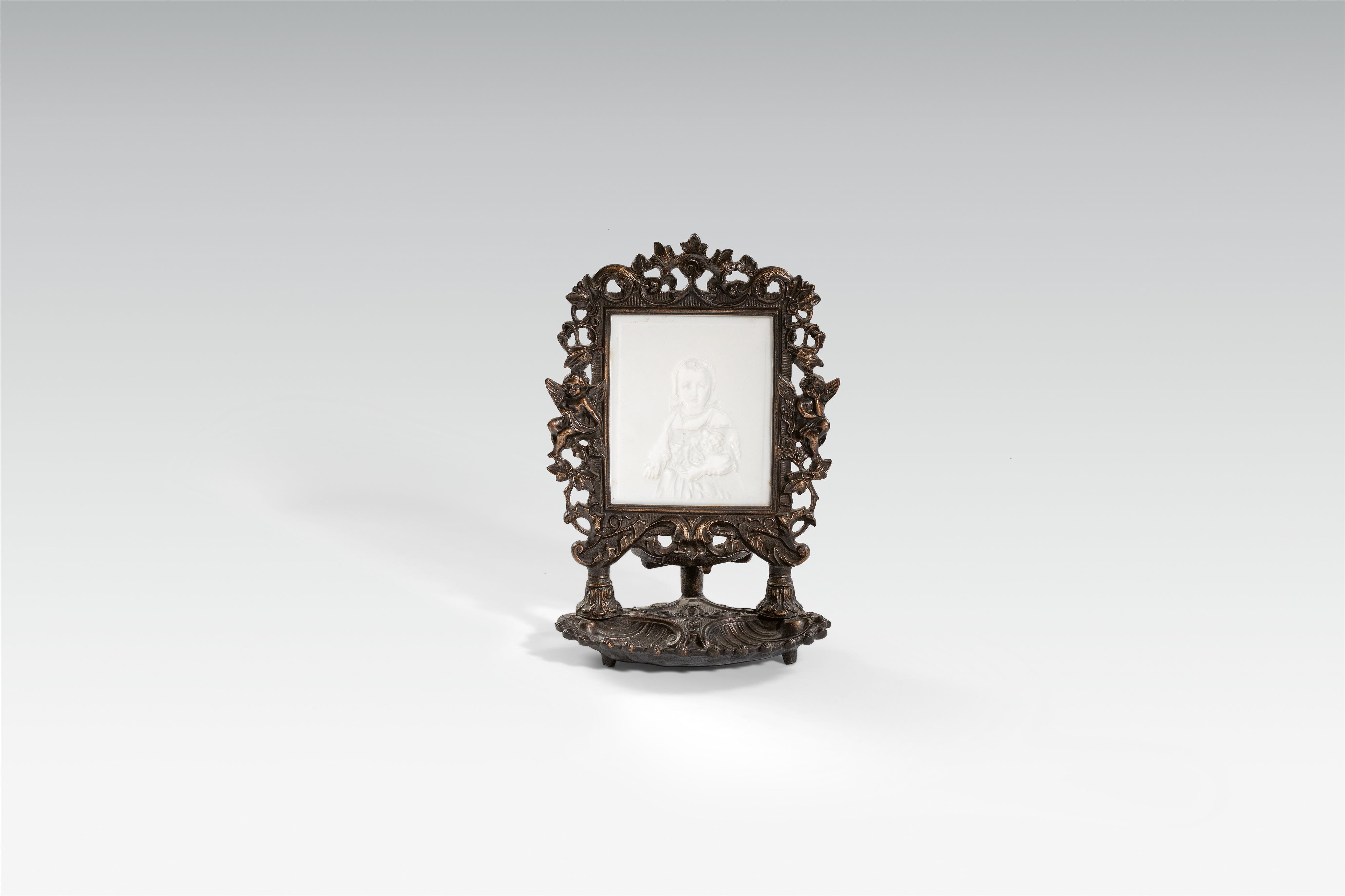 A lithophane in a cast iron stand - image-1