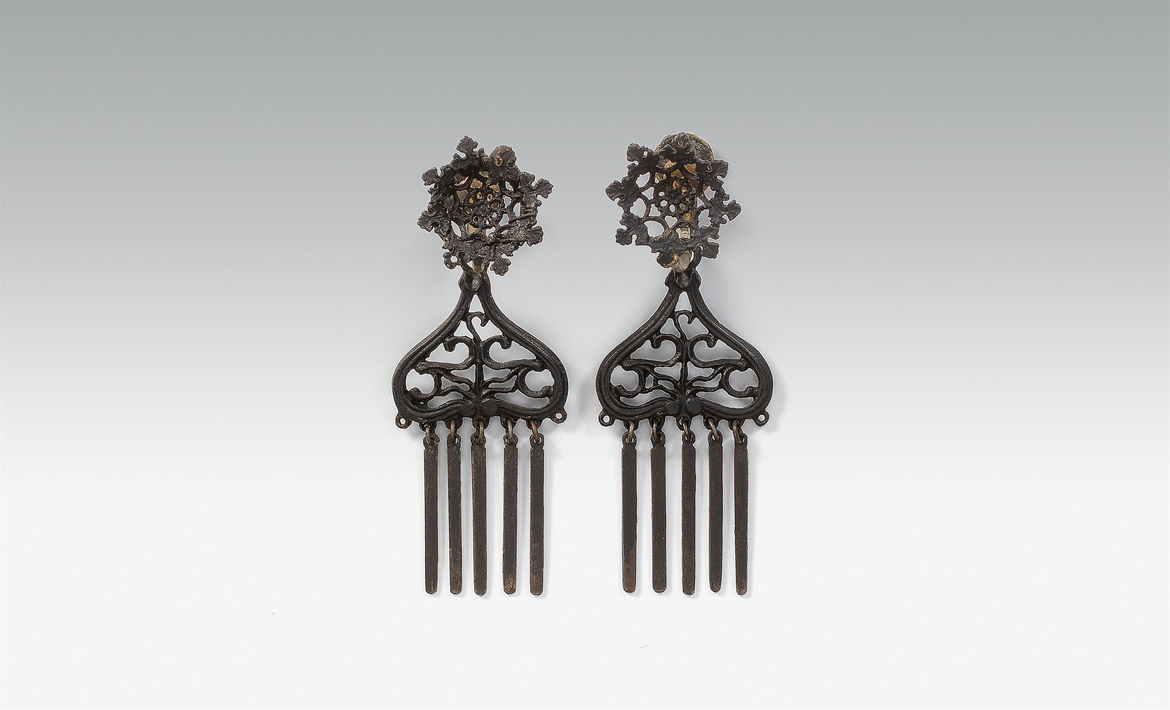 A pair of cast iron and brass earrings - image-1