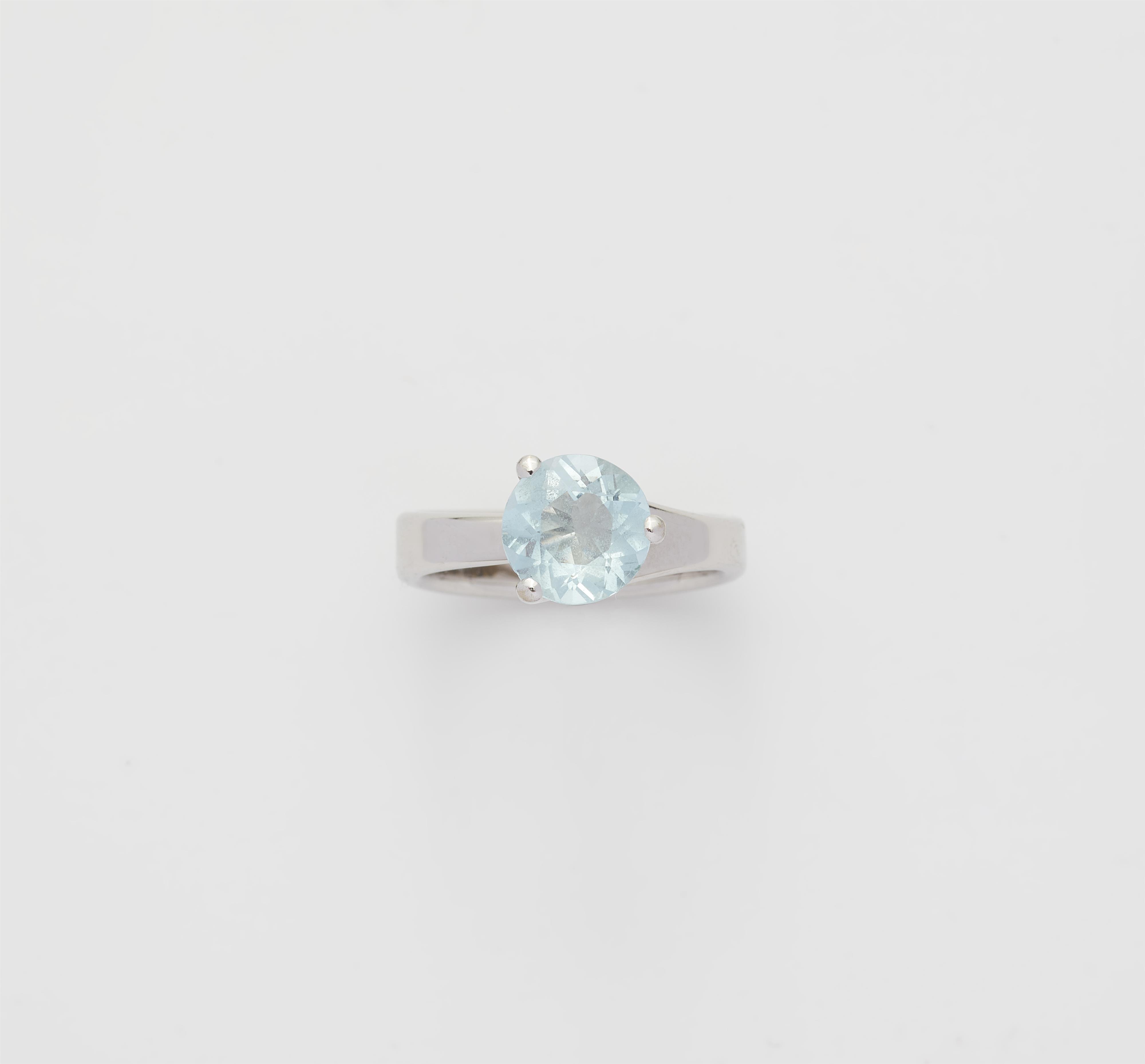 An 18k rhodium plated white gold and aquamarine ring. - image-1