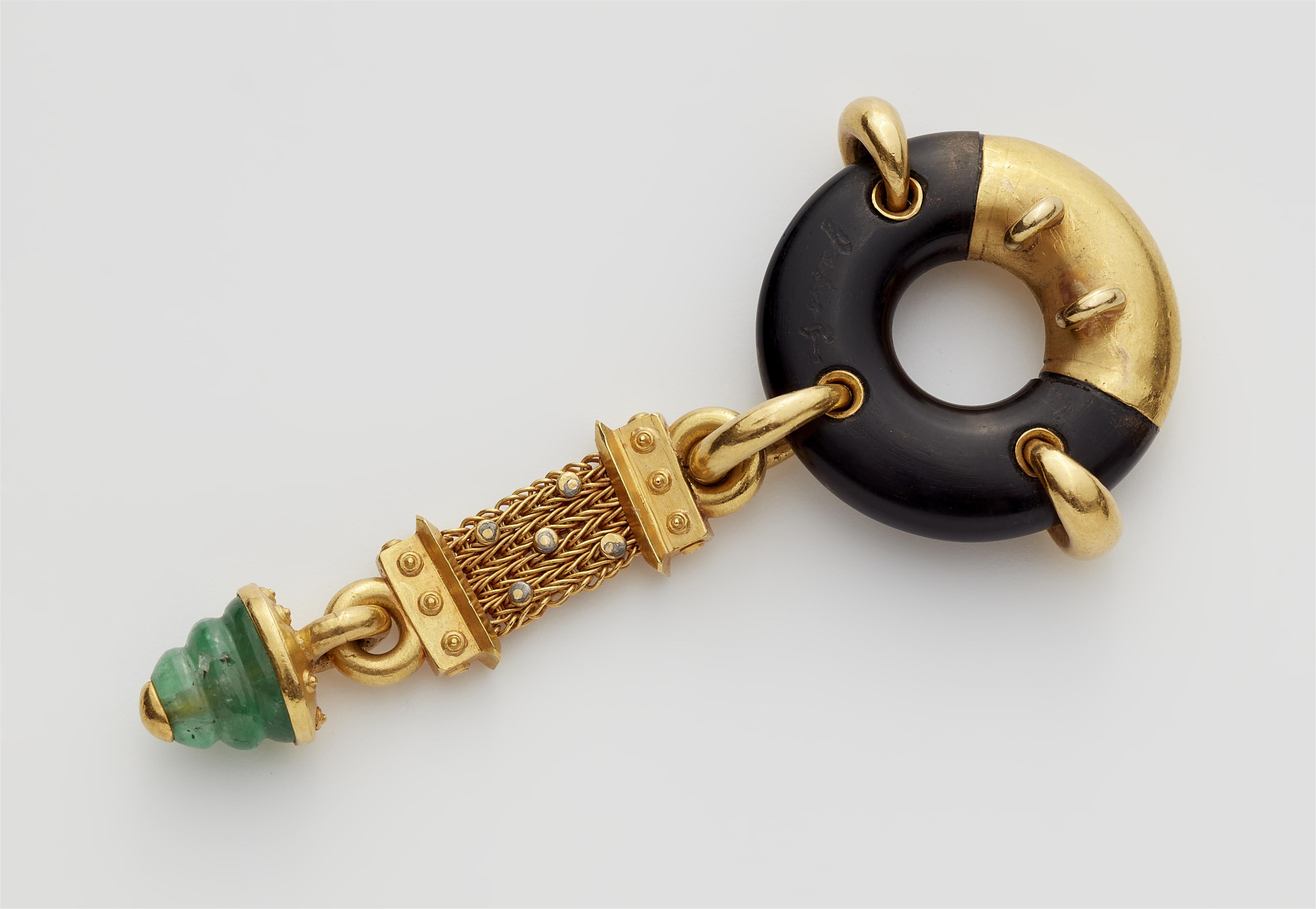 A German 18k gold ebony disc diamond and emerald pendant. - image-2