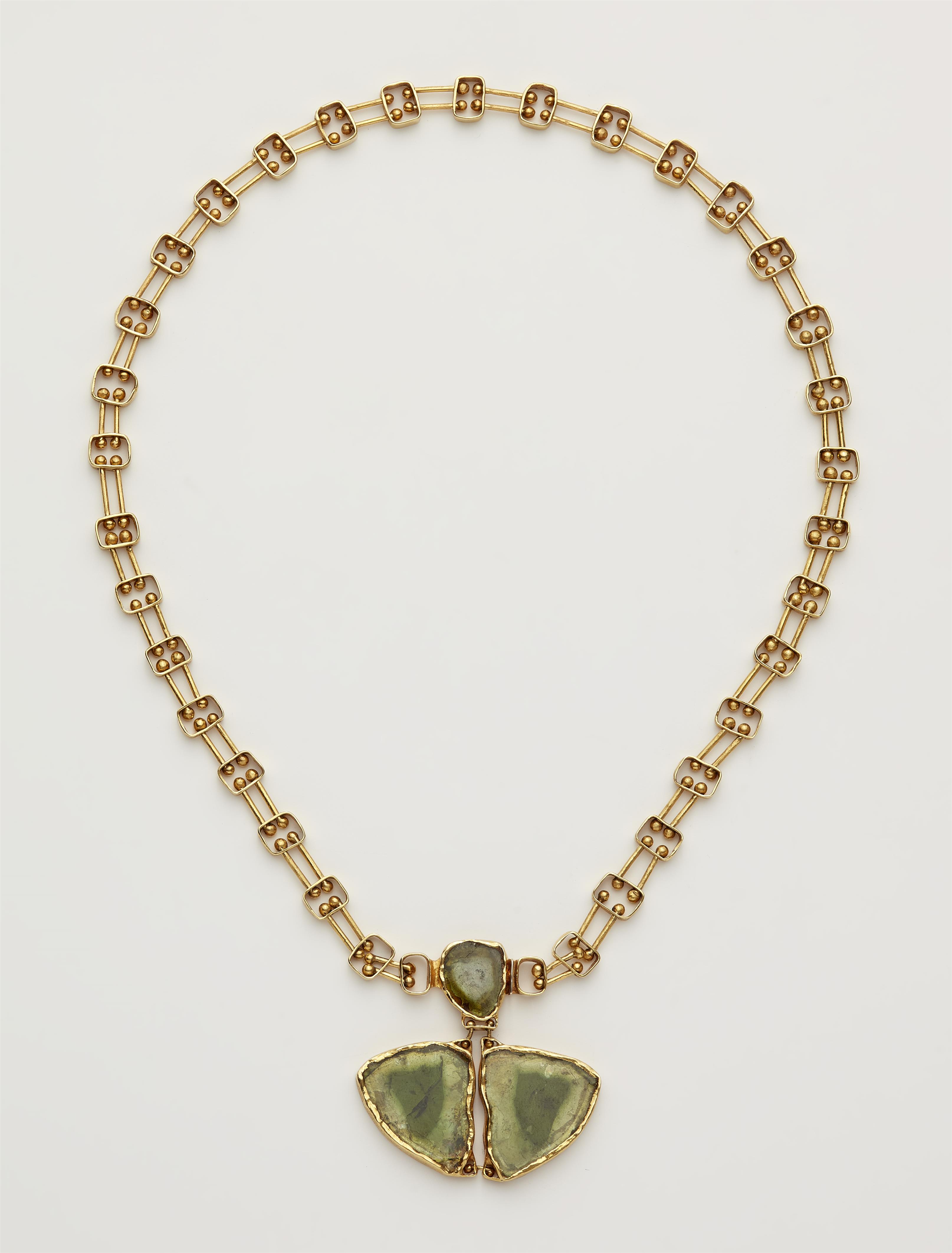 A German handforged 18k gold necklace with a green tourmaline clasp. - image-1