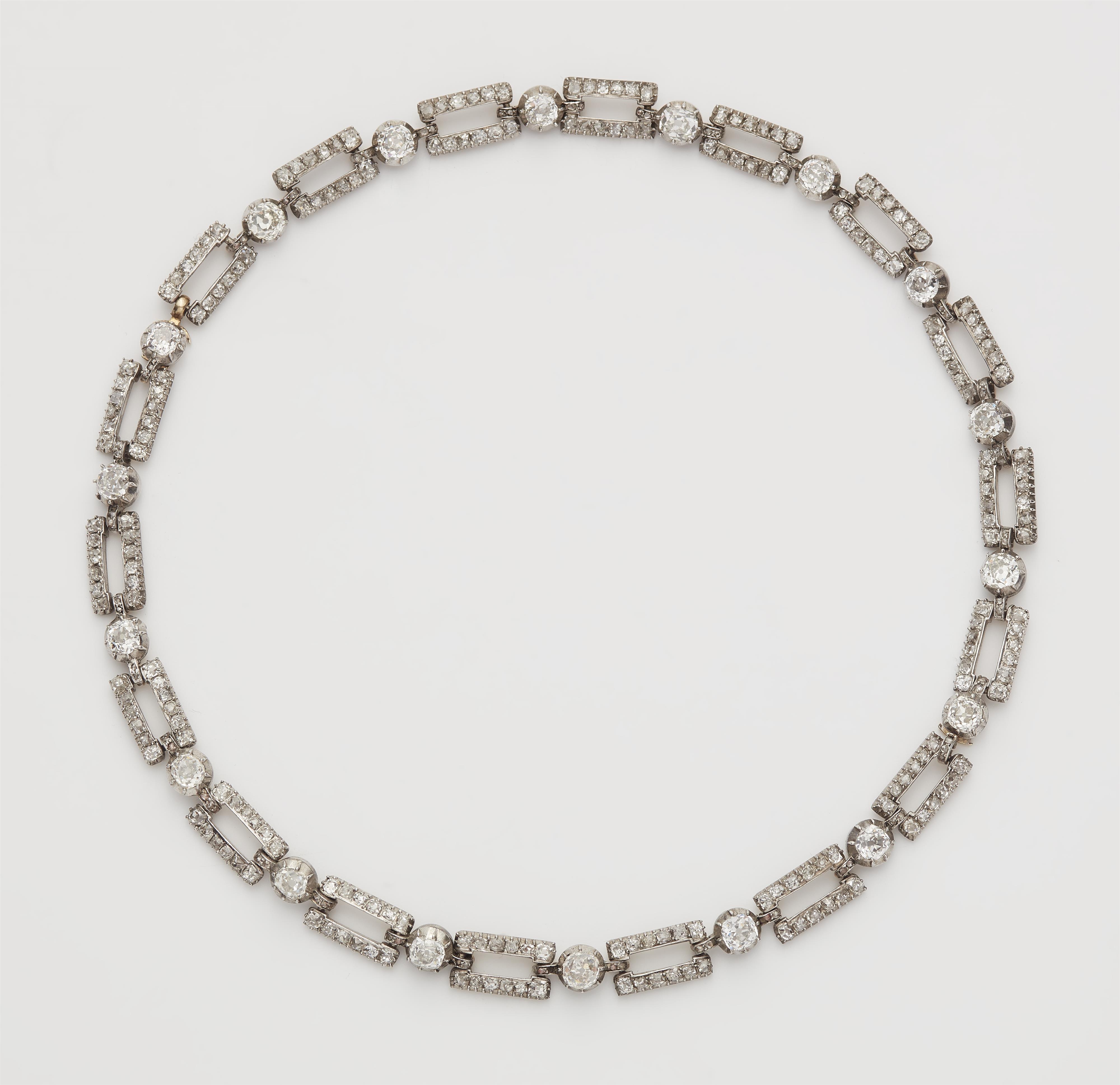 A silver 14k gold and diamond chain necklace convertable into two bracelets. - image-1