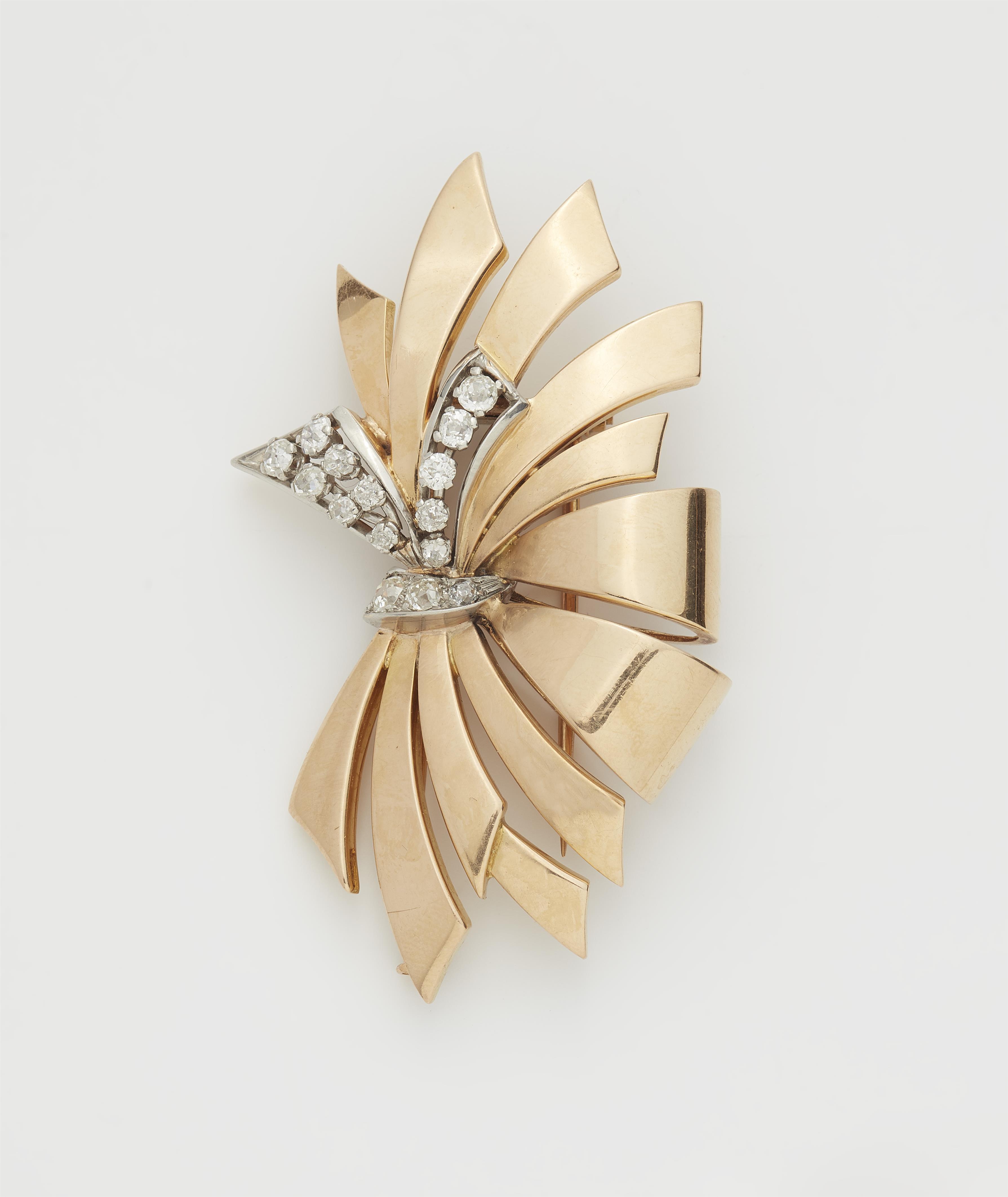 A French Retro Style 18k gold platinum and diamond bow clip brooch. - image-1