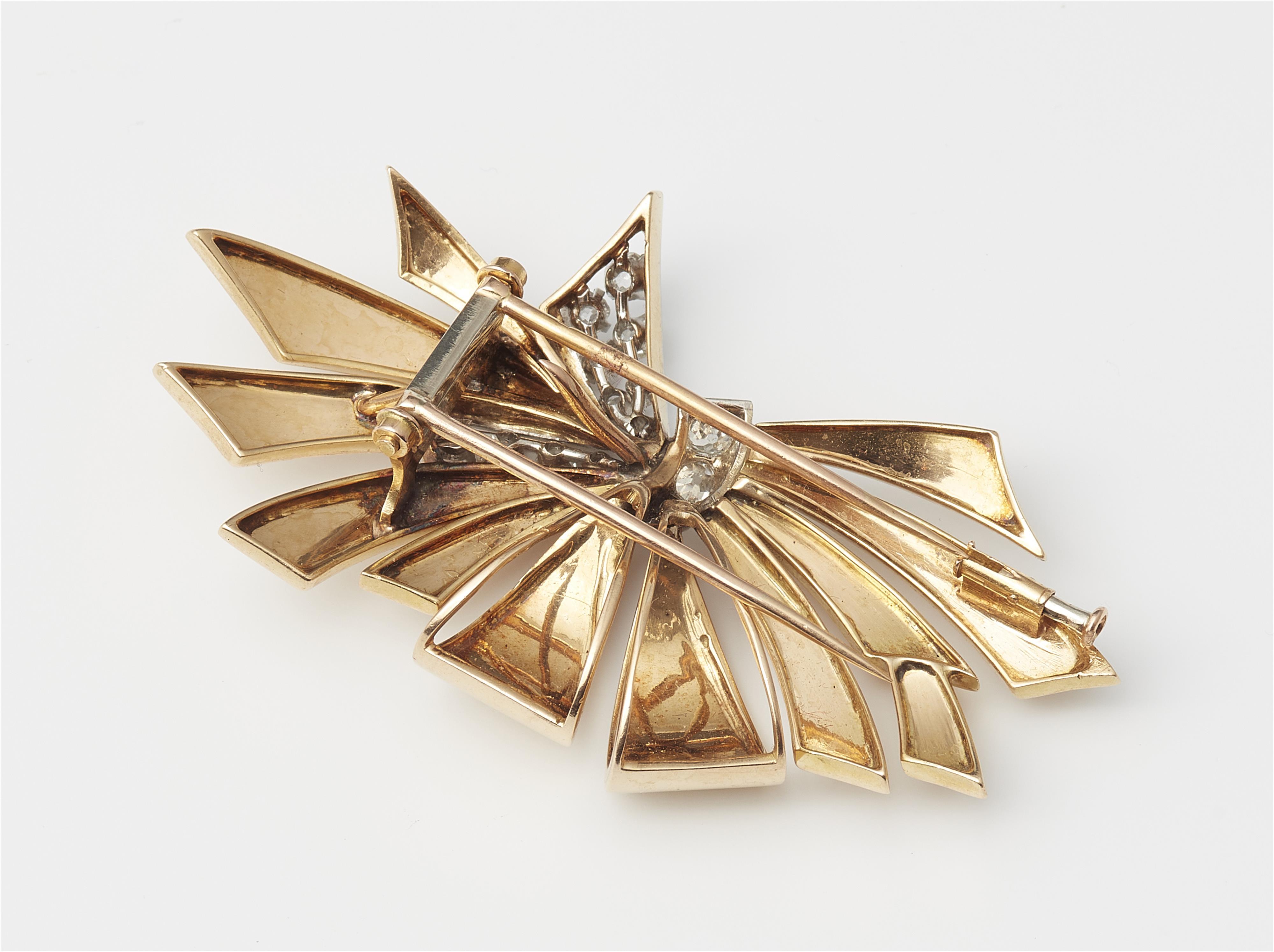 A French Retro Style 18k gold platinum and diamond bow clip brooch. - image-2