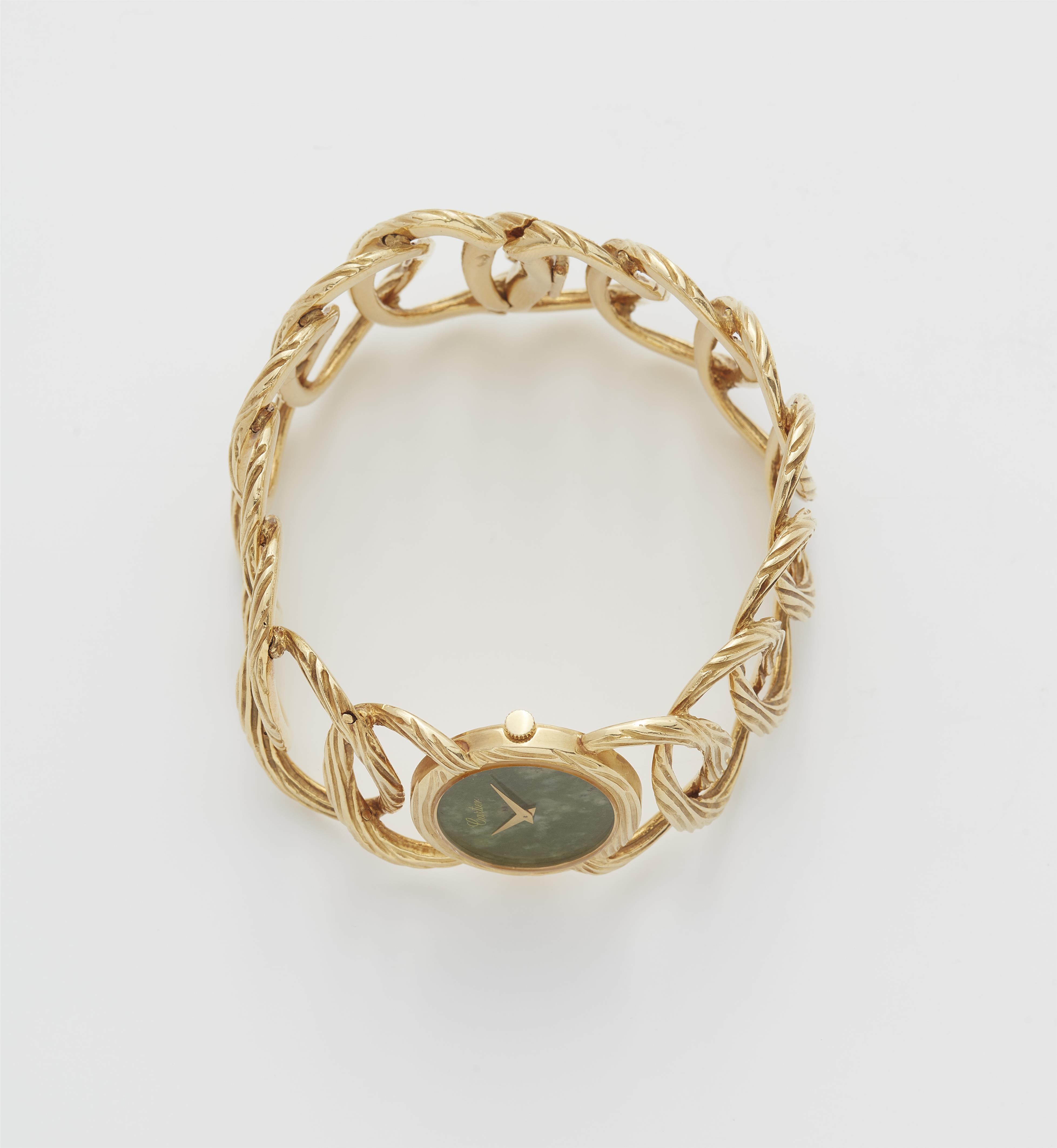 An 18k yellow gold and mottled green nephrite jade ladies' Piaget cuff wristwatch retailed by Cartier. - image-3