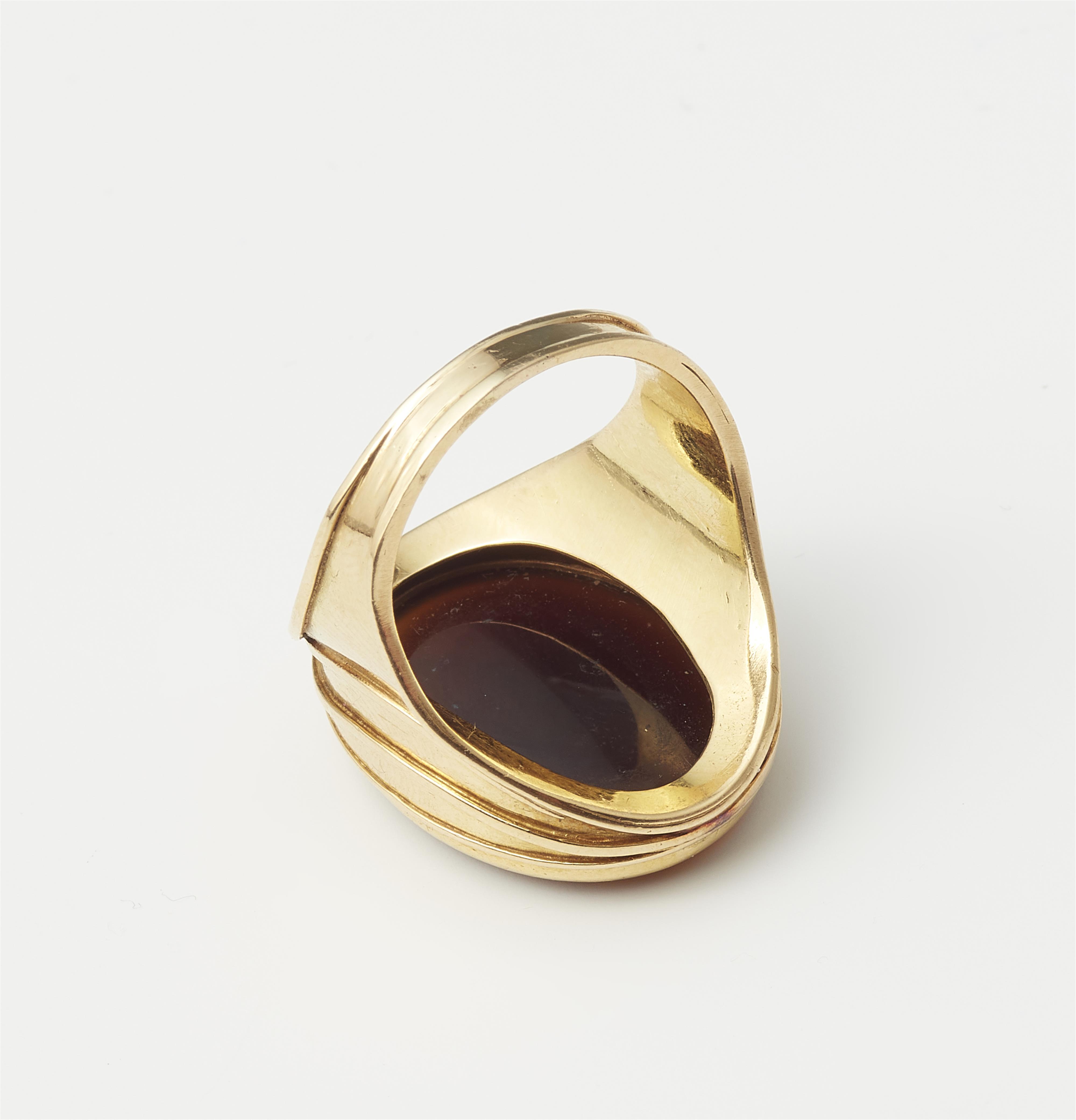 A German 18k gold and carnelian intaglio ring. - image-2