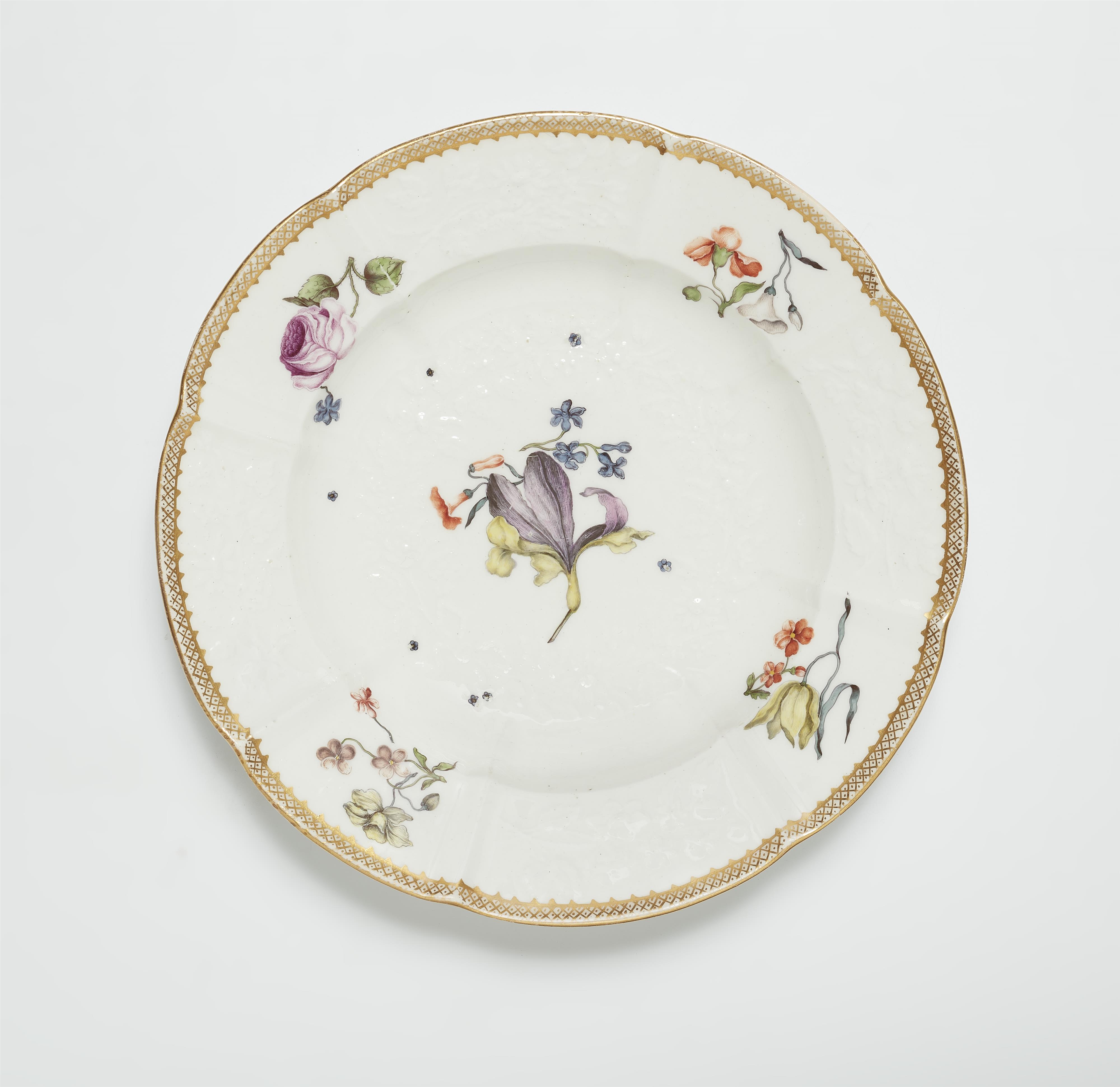 A Meissen porcelain plate from a dinner service with woodcut style flowers - image-1