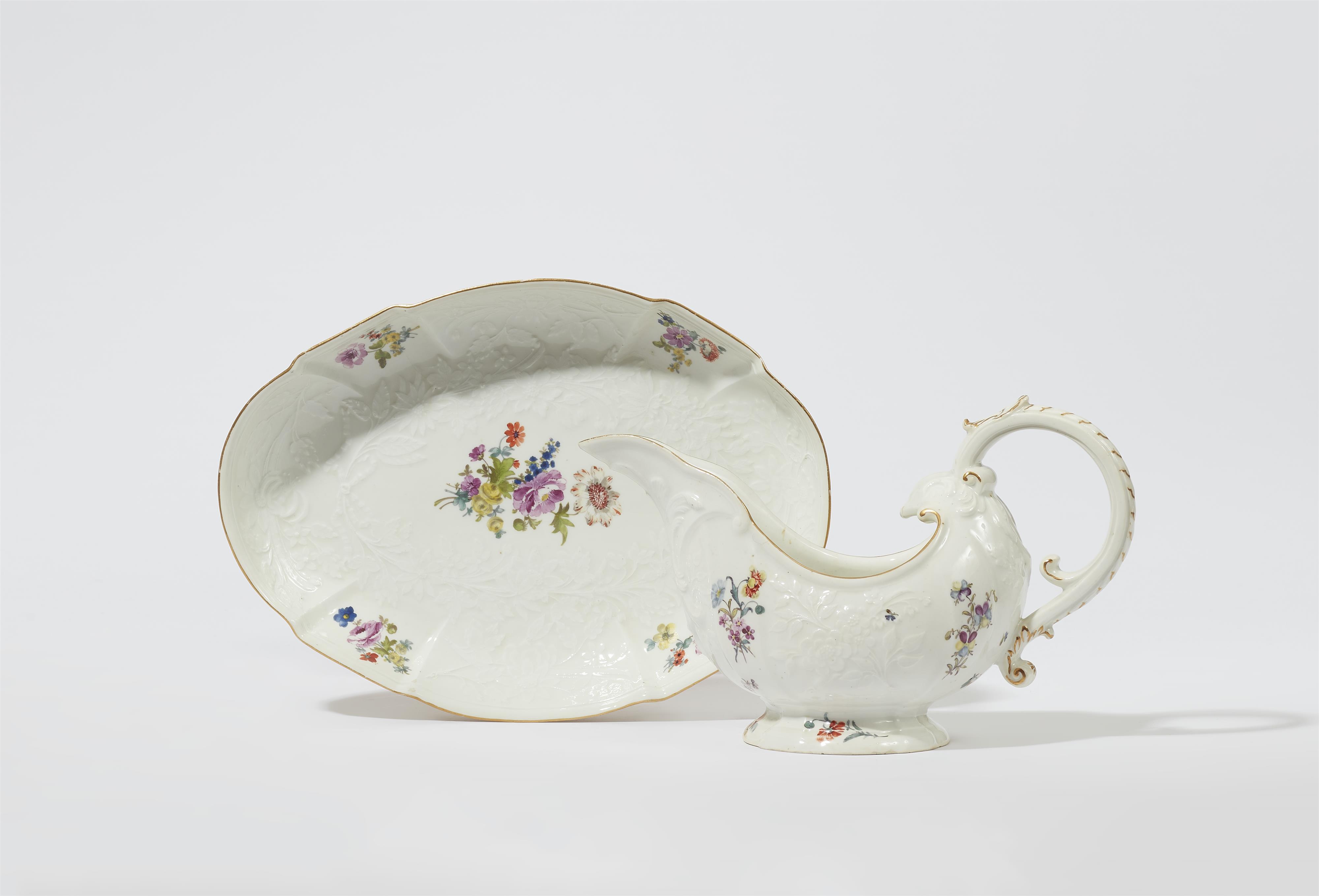 A Meissen porcelain sauce boat and dish from a dinner service with floral decor - image-1
