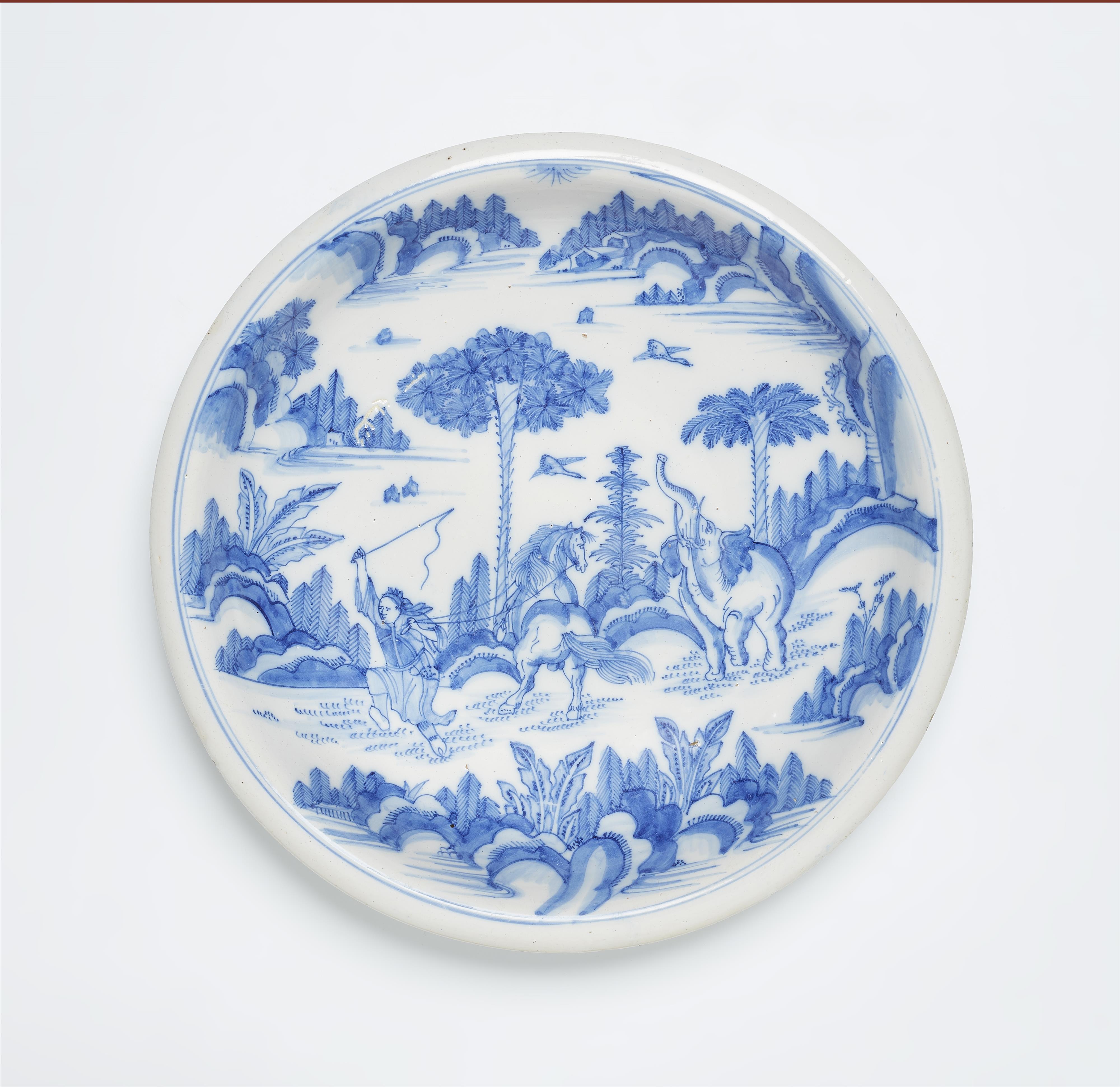 A faience dish with Chinoiserie motifs and an elephant - image-1