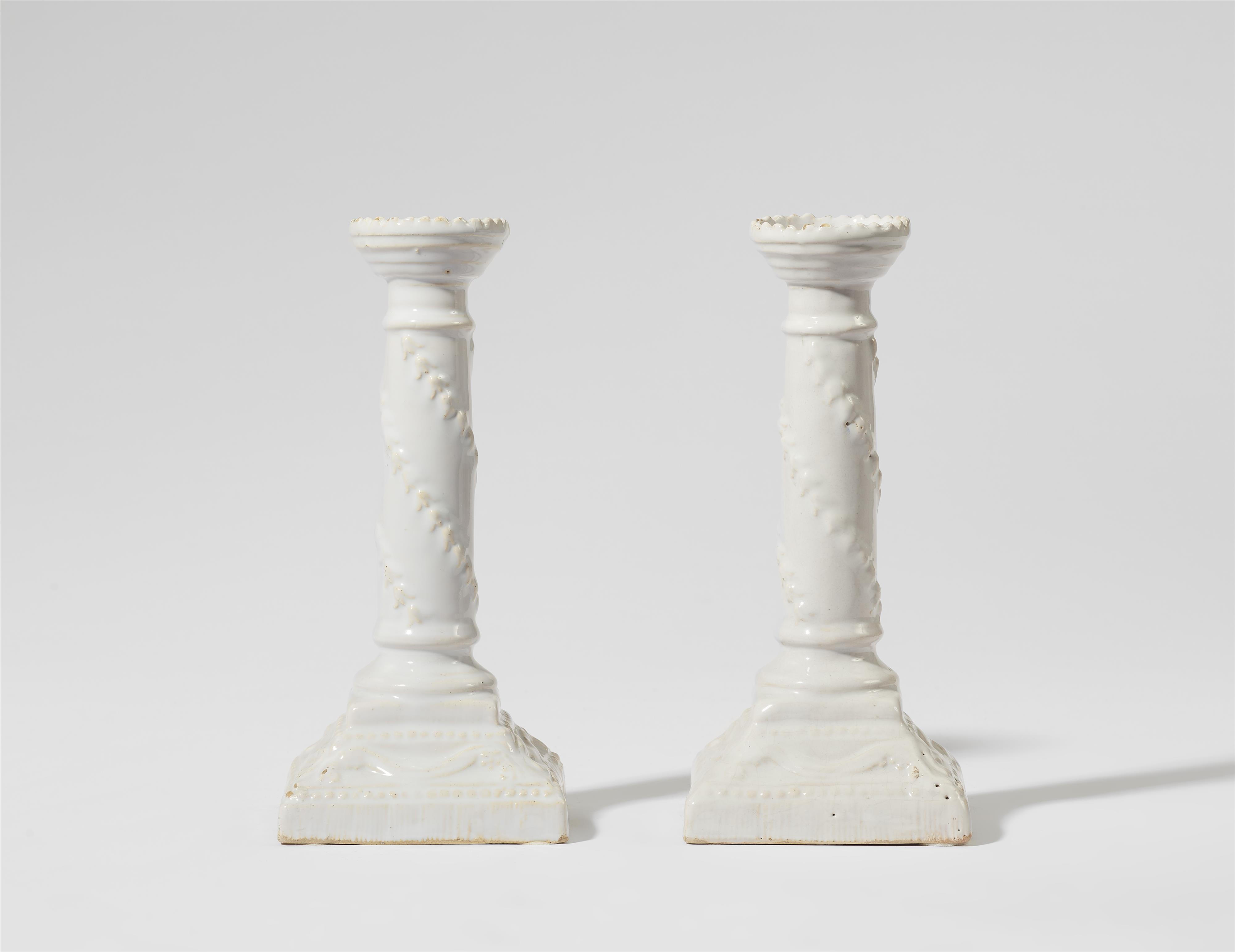 A pair of Neoclassical Proskau faience candlesticks - image-1