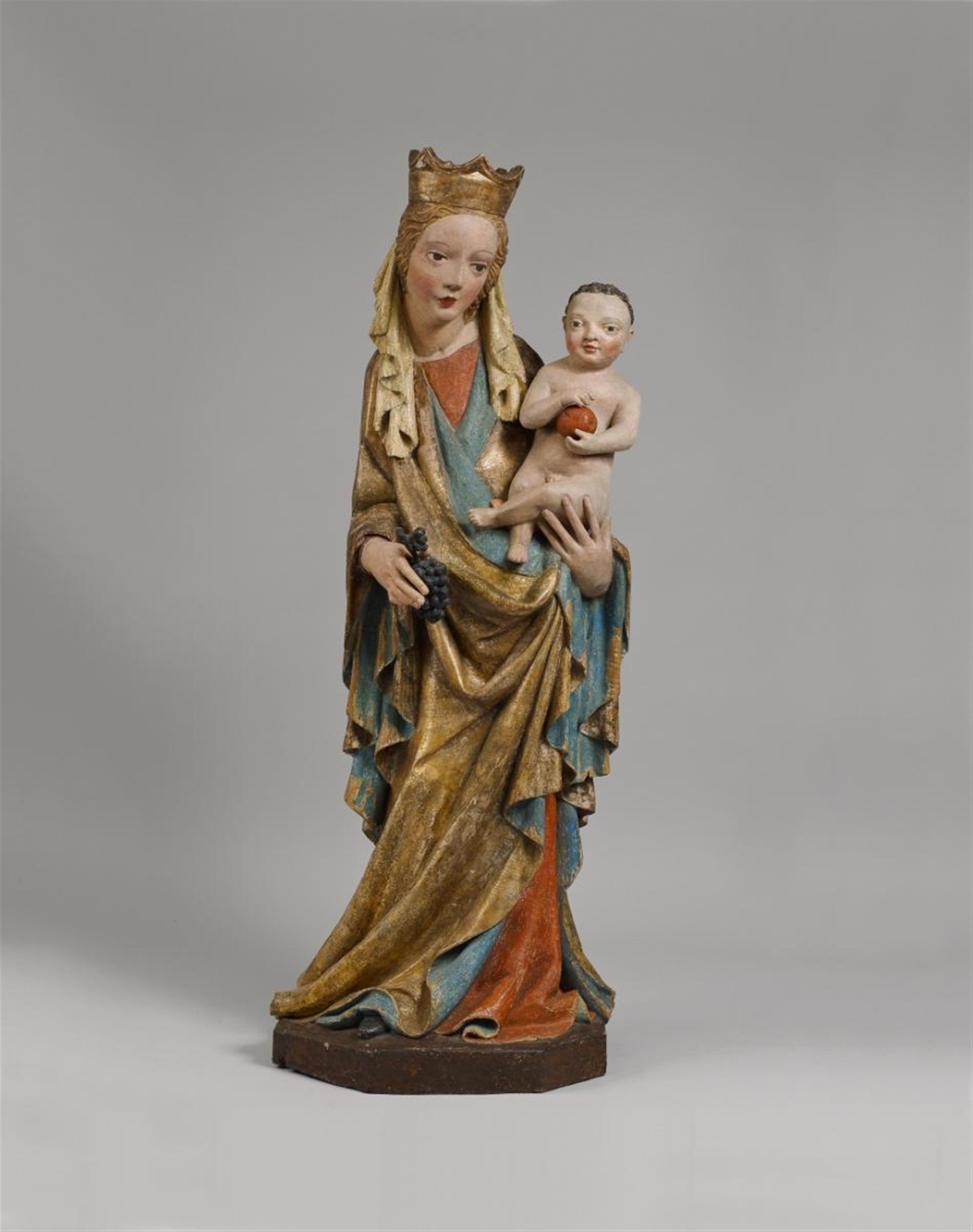 A high-relief carved wood figure of THE VIRGIN WITH CHILD - image-1