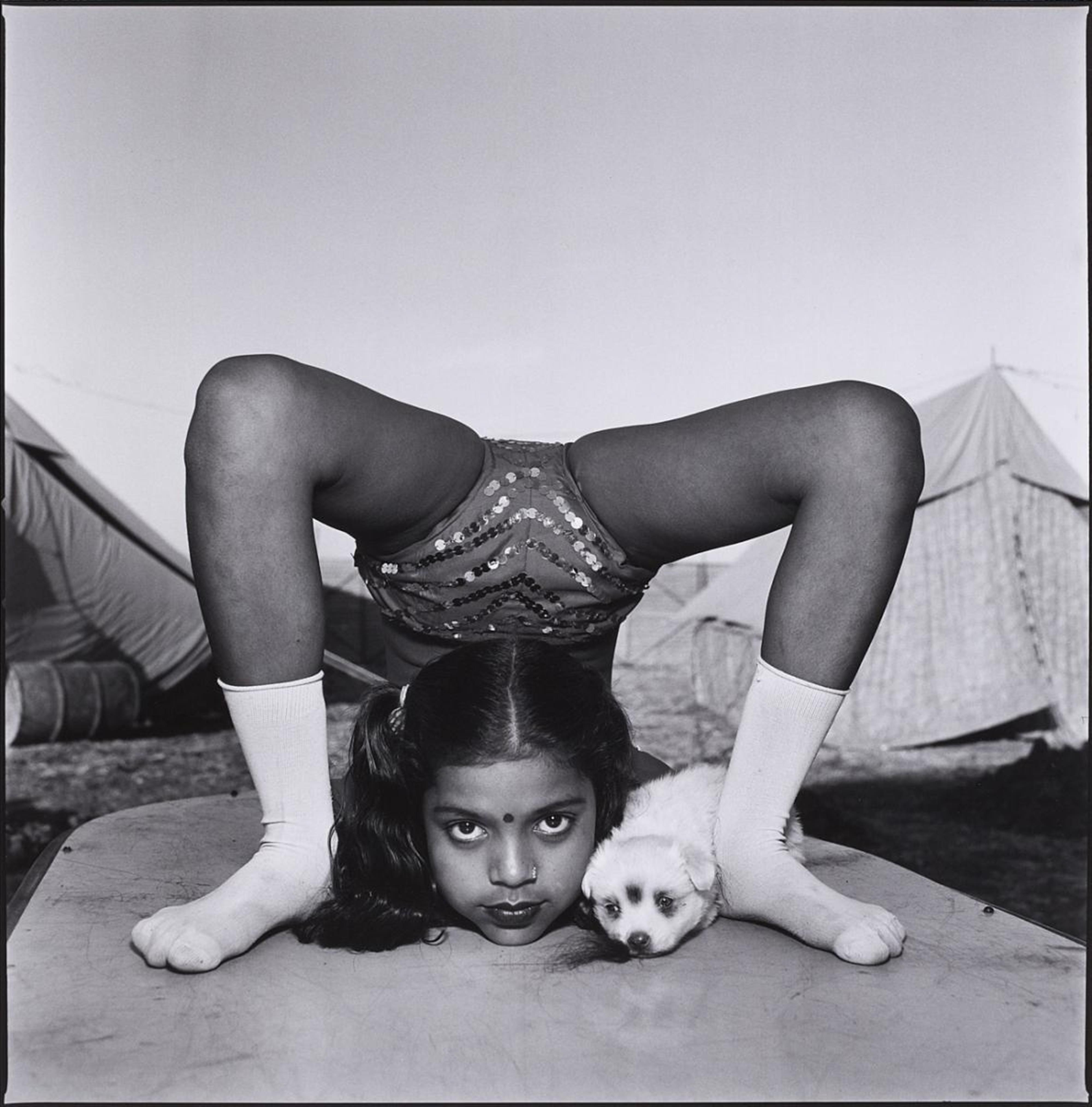 Mary Ellen Mark - Contortionist with her Puppy Sweety, Great Raj Kamal Circus, Upleta, India - image-1