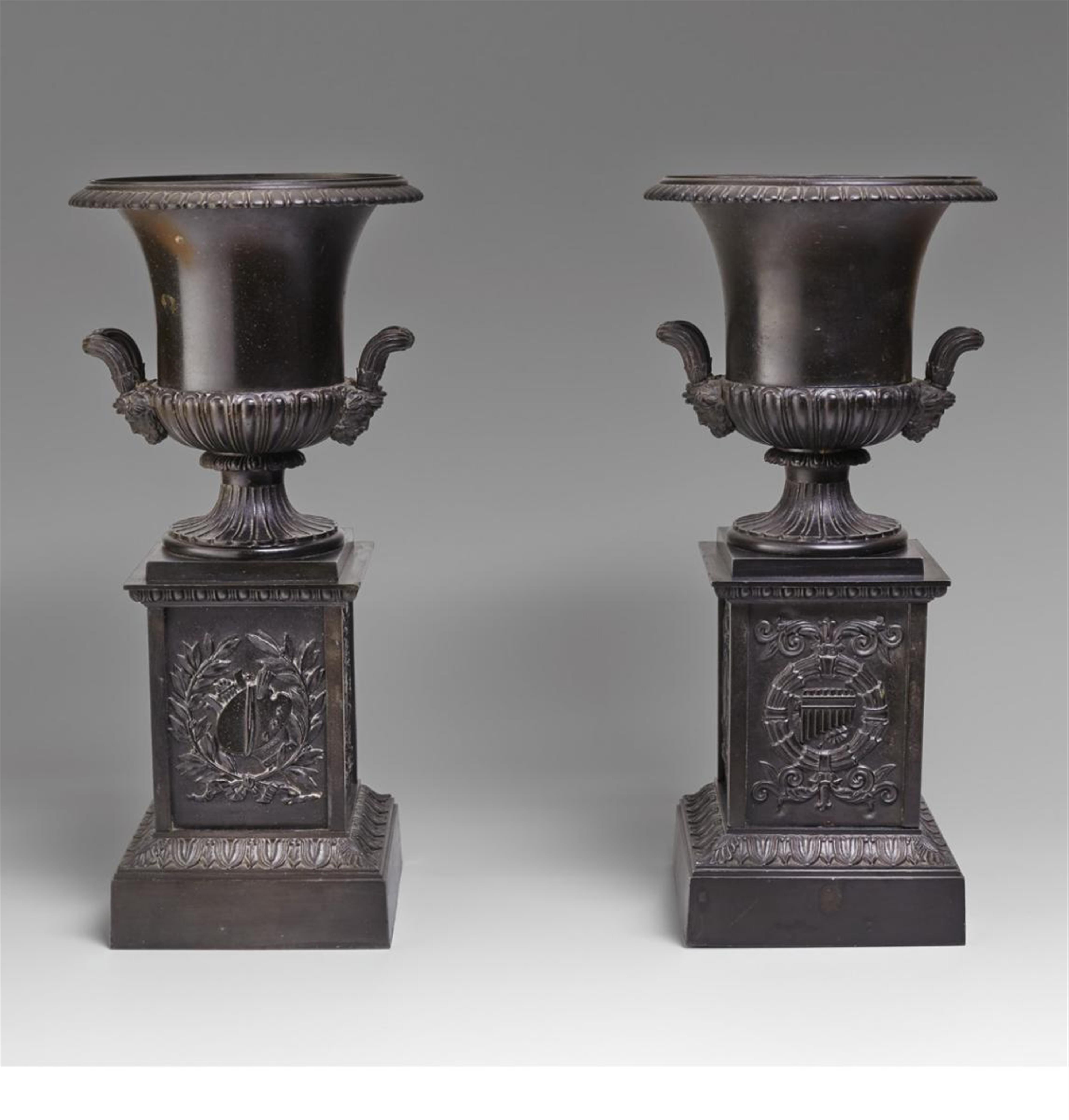 A pair of black patinated cast zink vases. - image-1