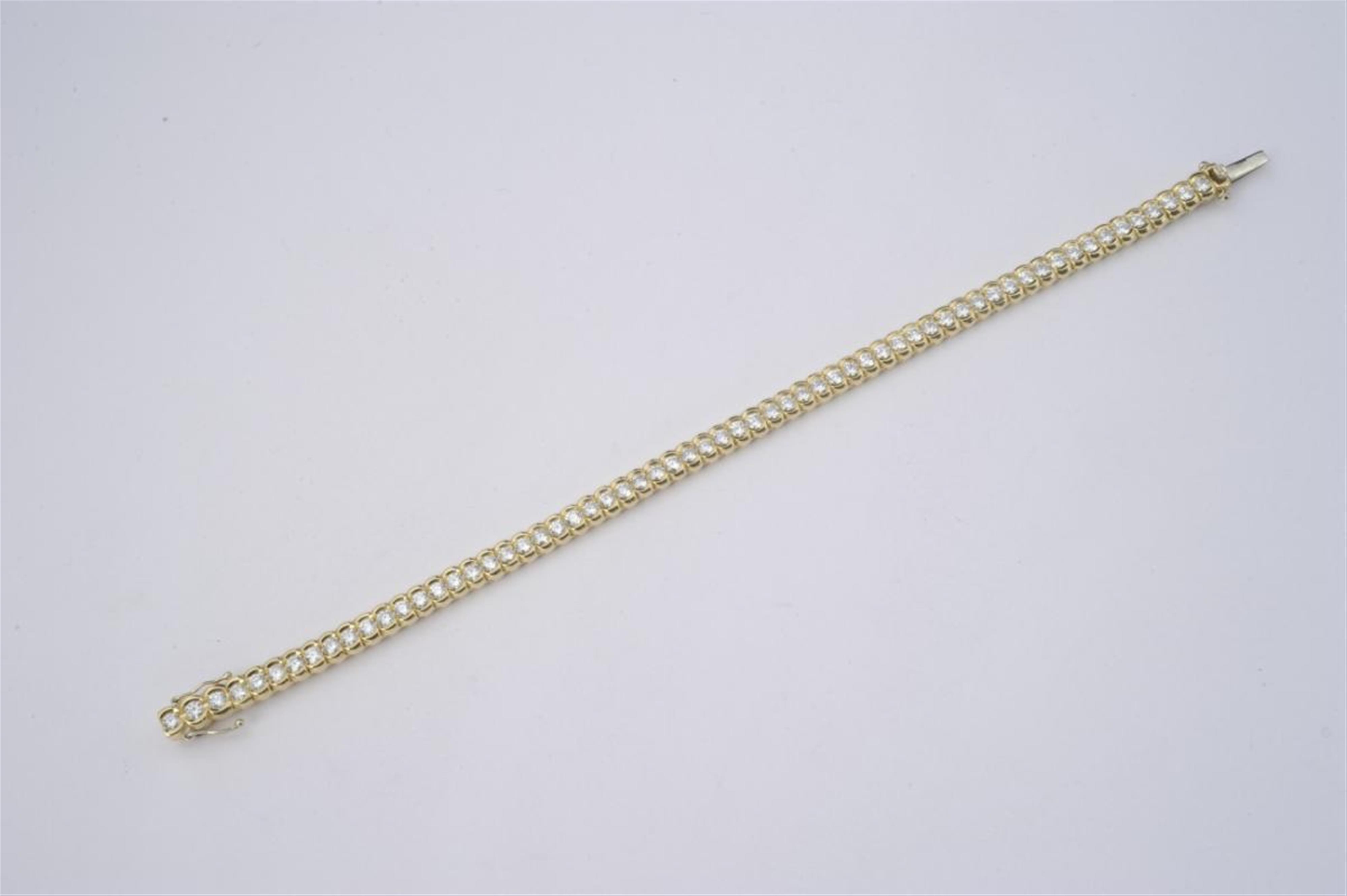 An 18k gold and diamond tennis bracelet - image-1