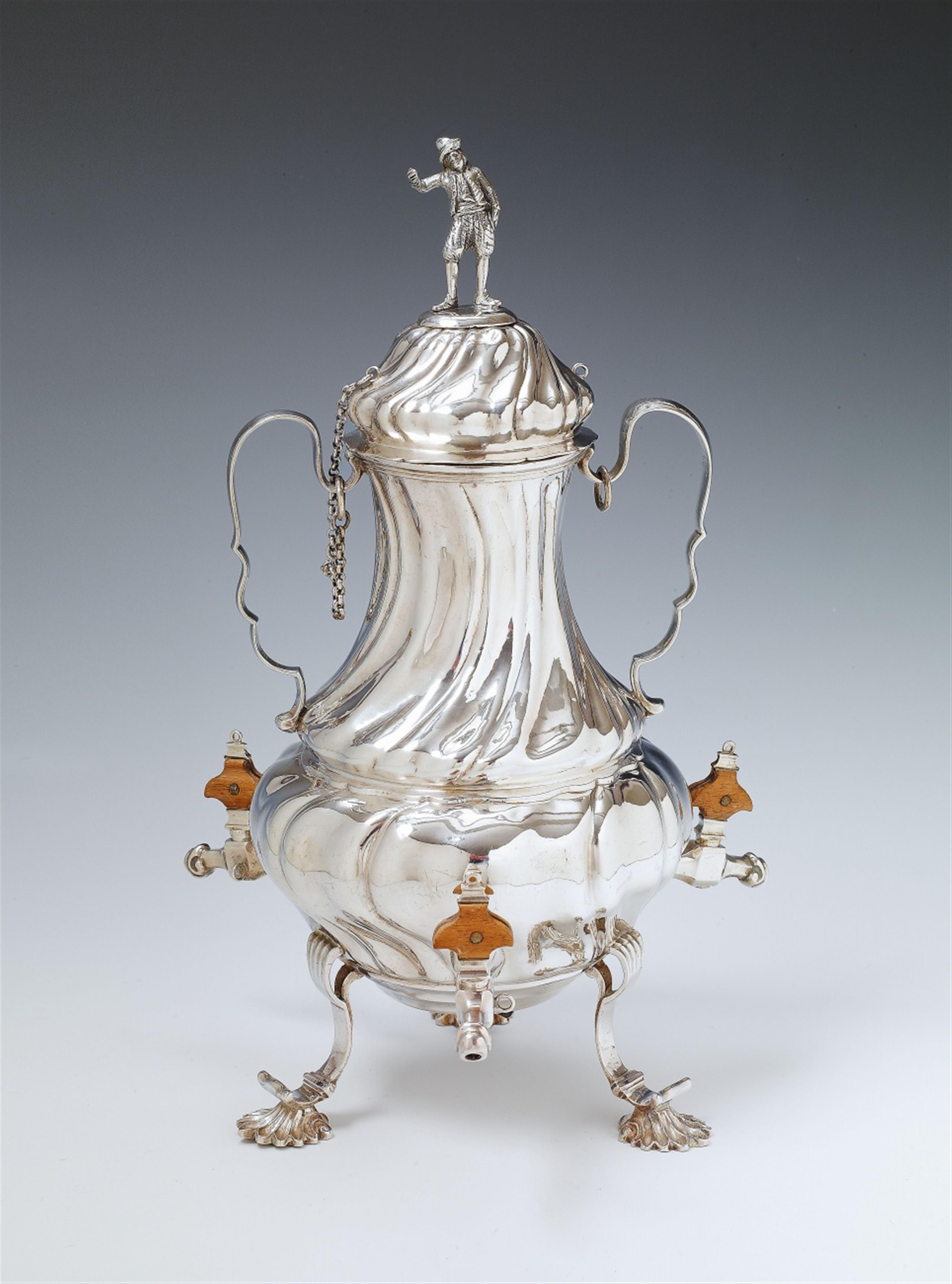 An Augsburg silver coffee urn with three wooden handled taps. Marks of Johann Georg Kloss(e), 1747 - 49. - 