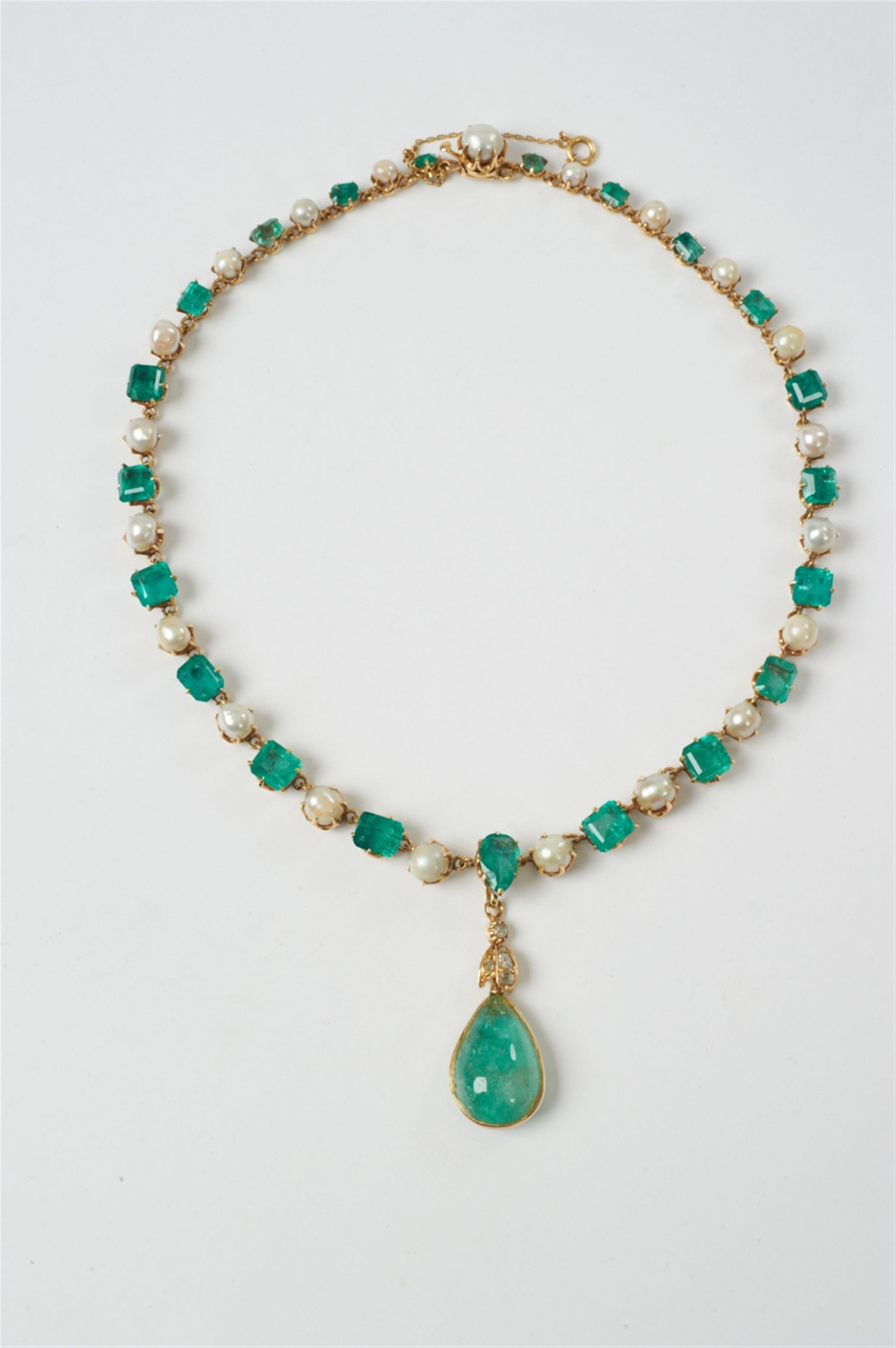 An 18k gold, emerald and pearl necklace with diamond-set droplet ...