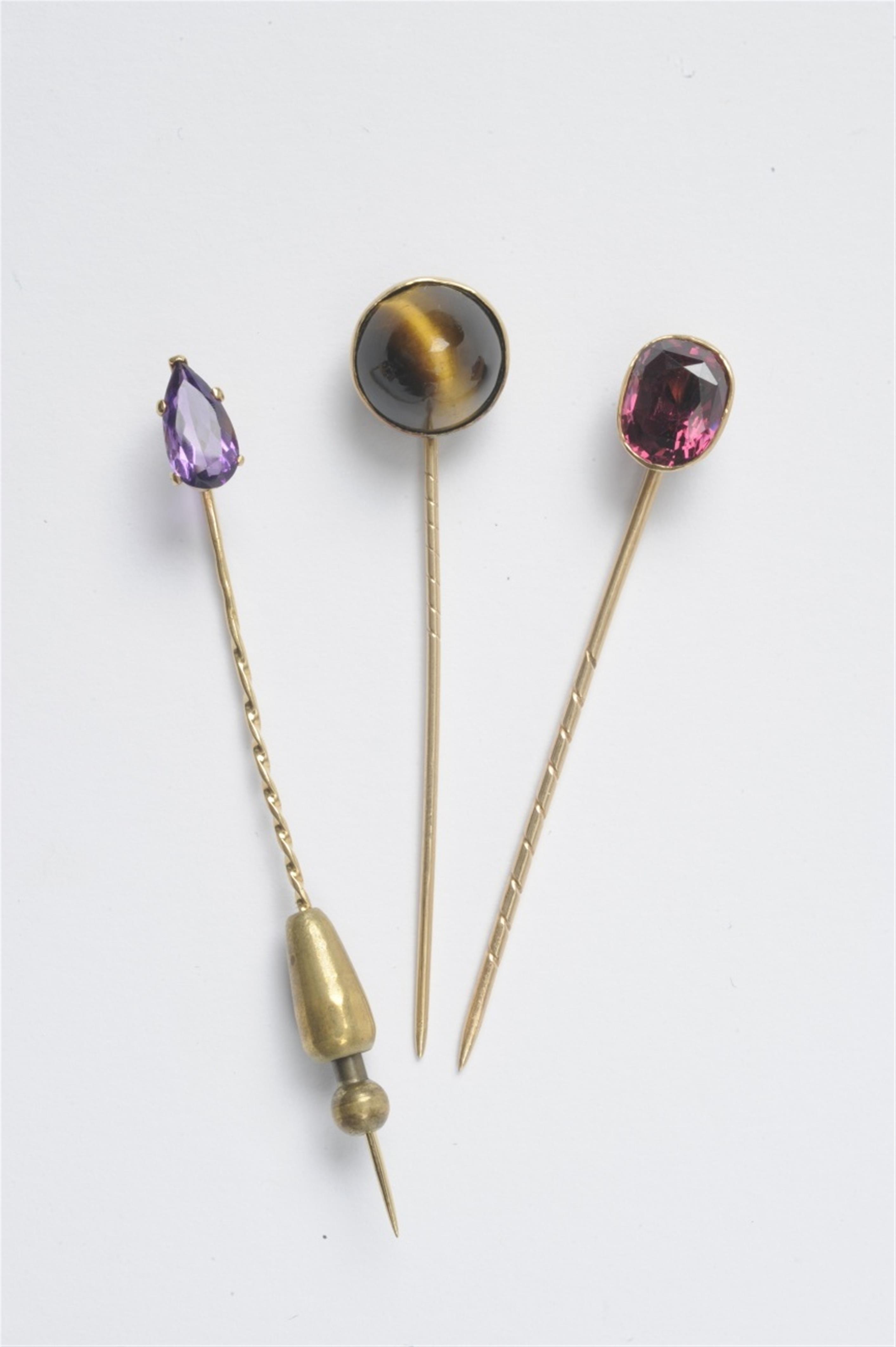 Three gold and coloured gem tie pins - image-1