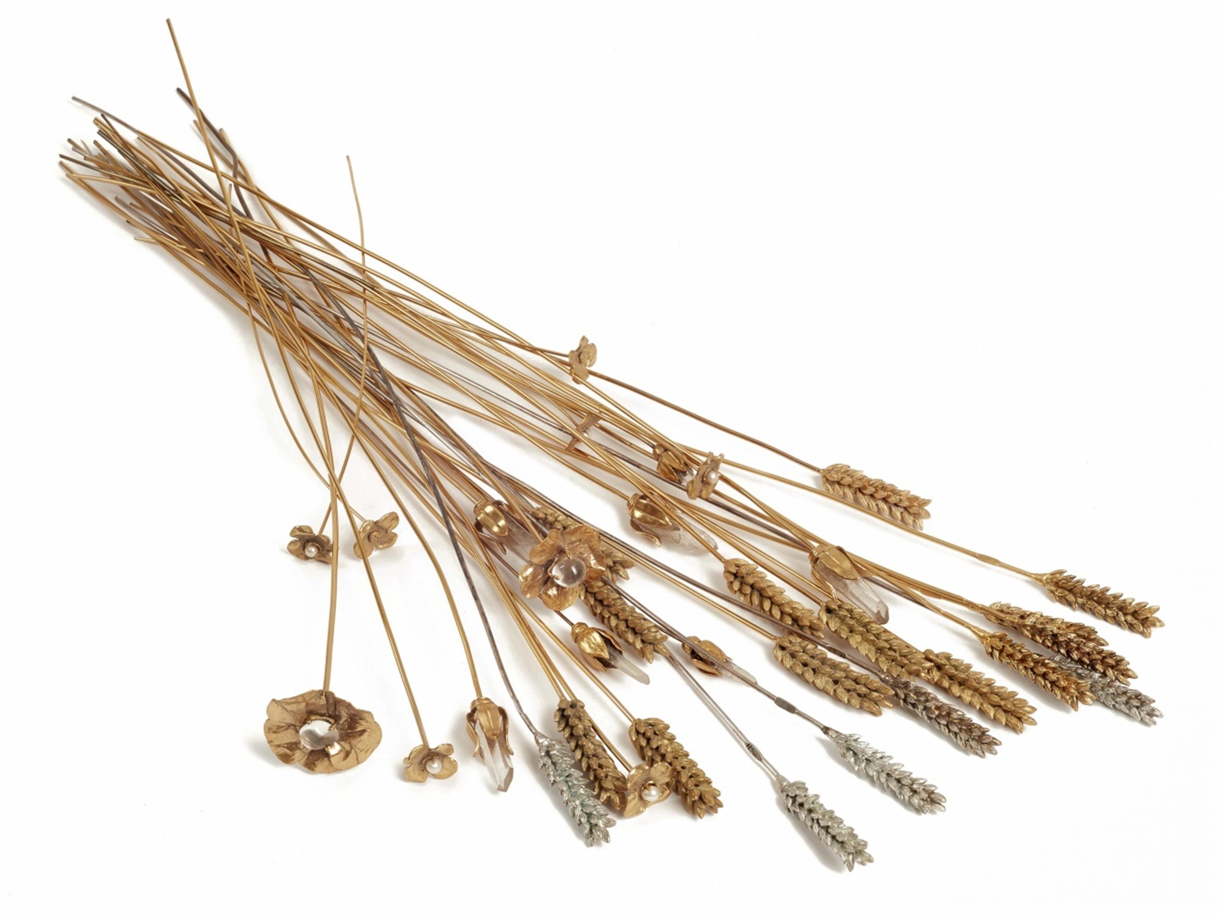 Eighteen gold ans silver plated metal ears of wheat, nine camellias and seven flowers - 