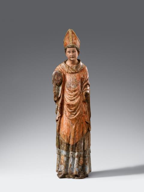 Probably Maasland, mid-14th century - A carved wood figure of a Holy Bishop, probably Meuse Region, mid-14th century