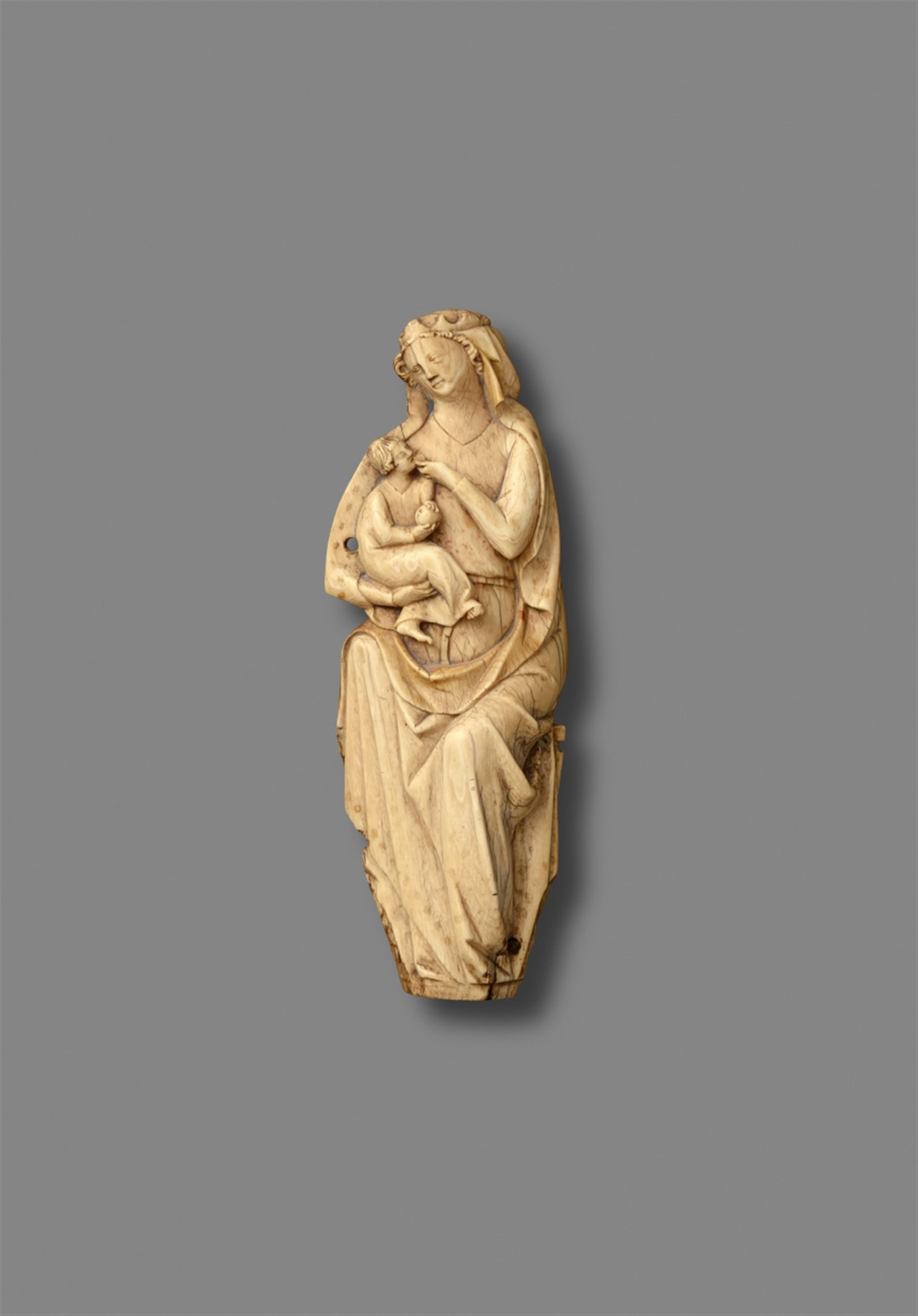 Probably Northern France first half 14th century - A carved ivory figure of the Virgin Enthroned, probably Northern France, first half 14th century - image-1