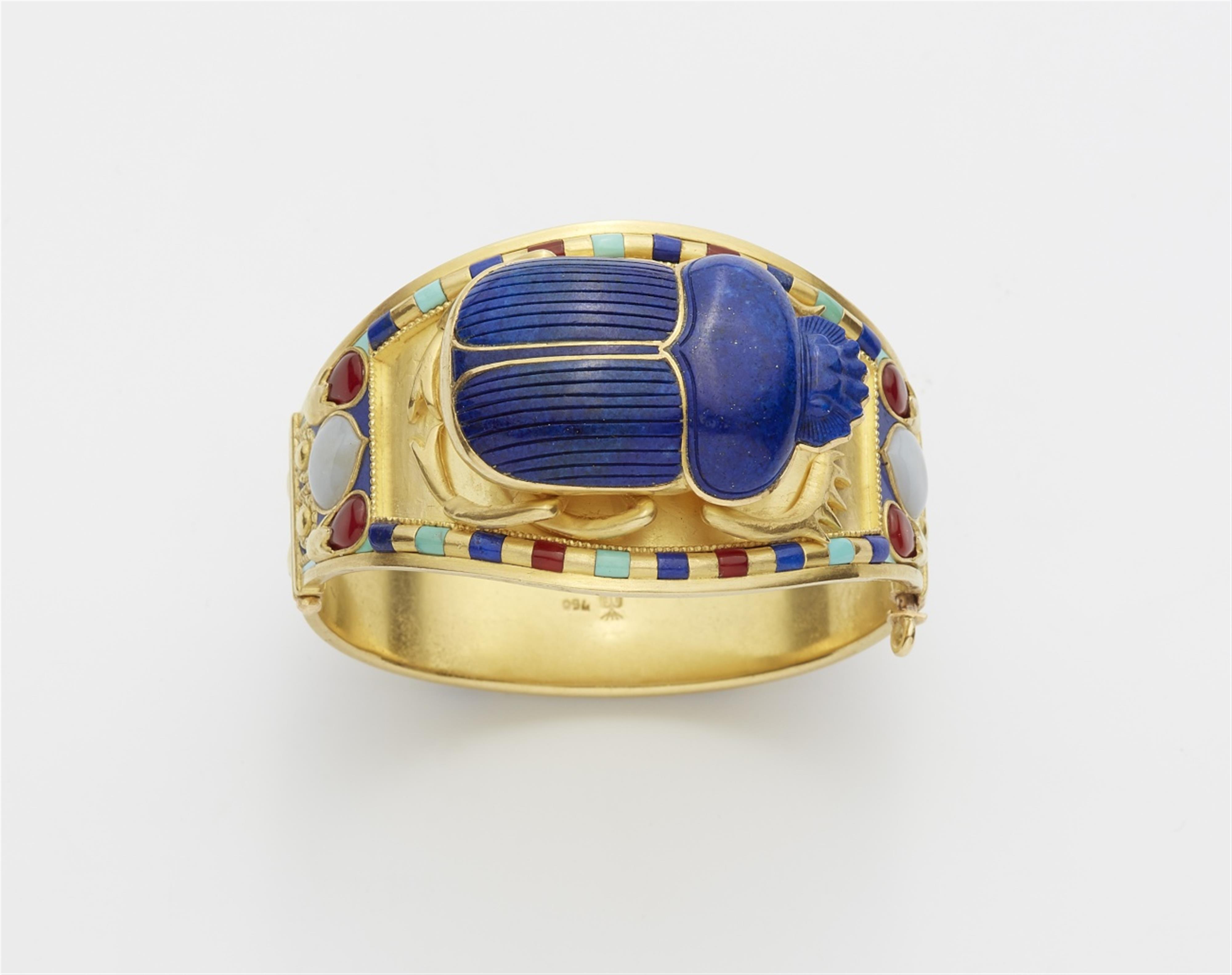 An 18k gold and hard stone scarab bracelet - image-1