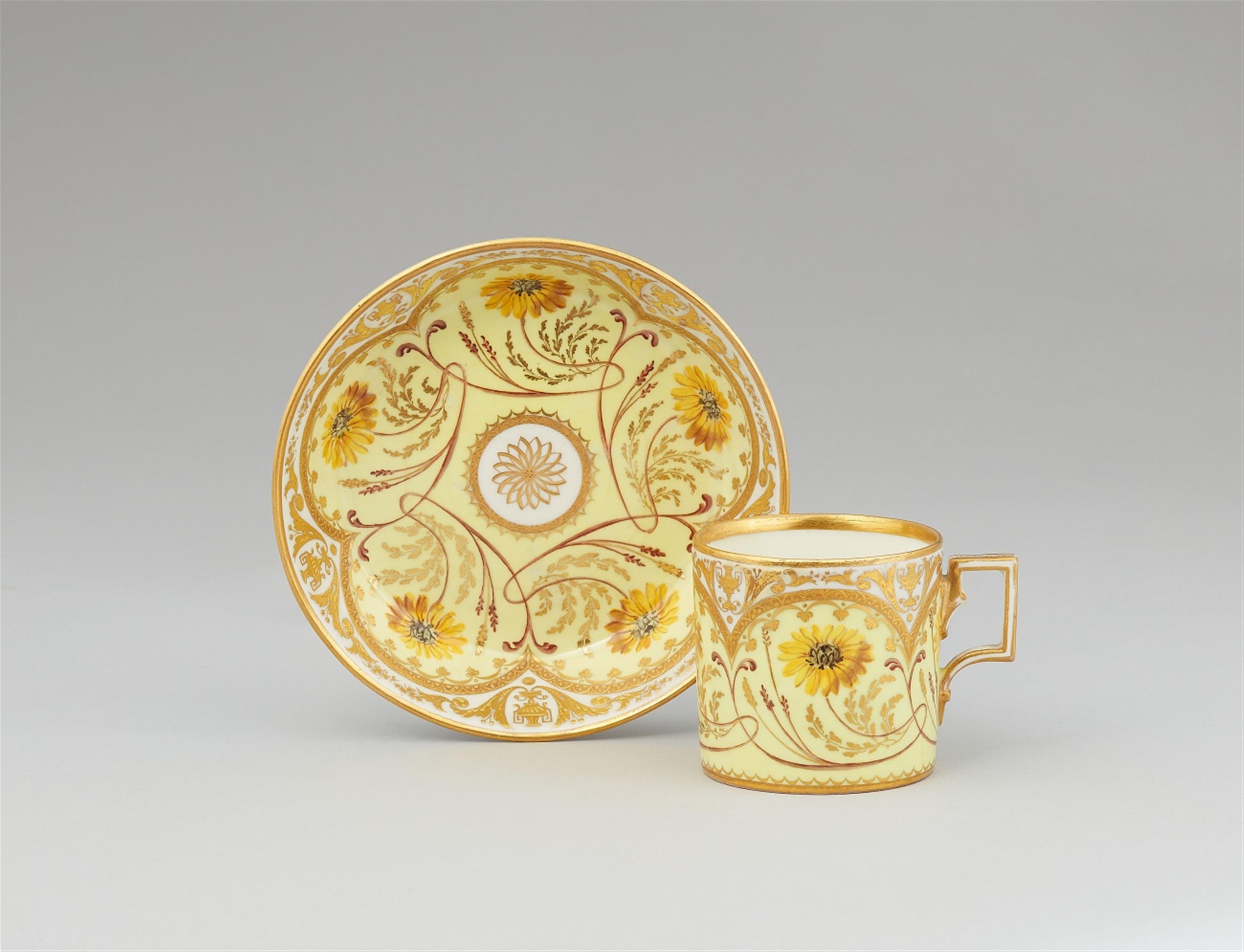 A Vienna porcelain cup and saucer with yellow chrysanthemums - image-1