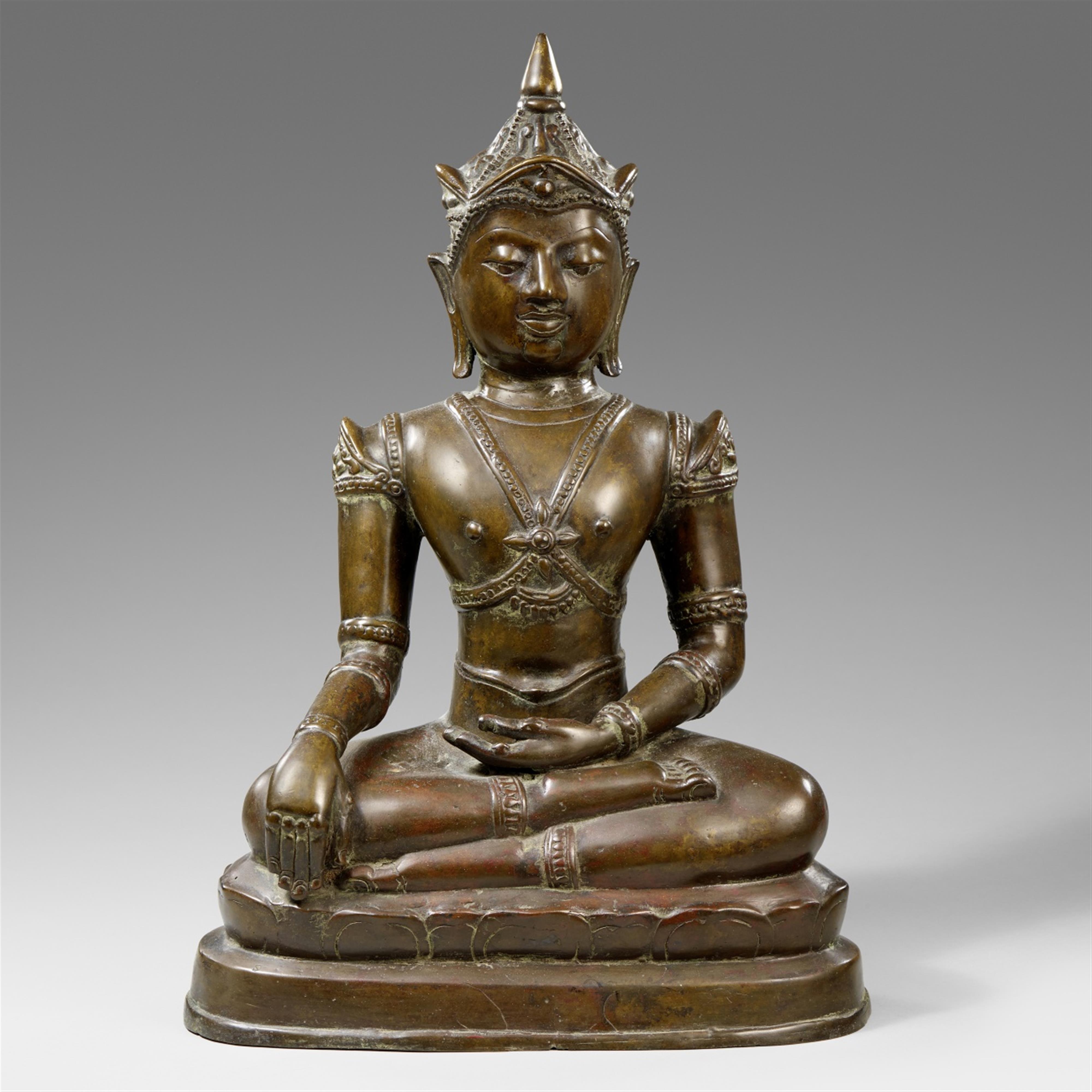 A Northern Thai bronze crowned and bejeweled Buddha. 17th century or ...