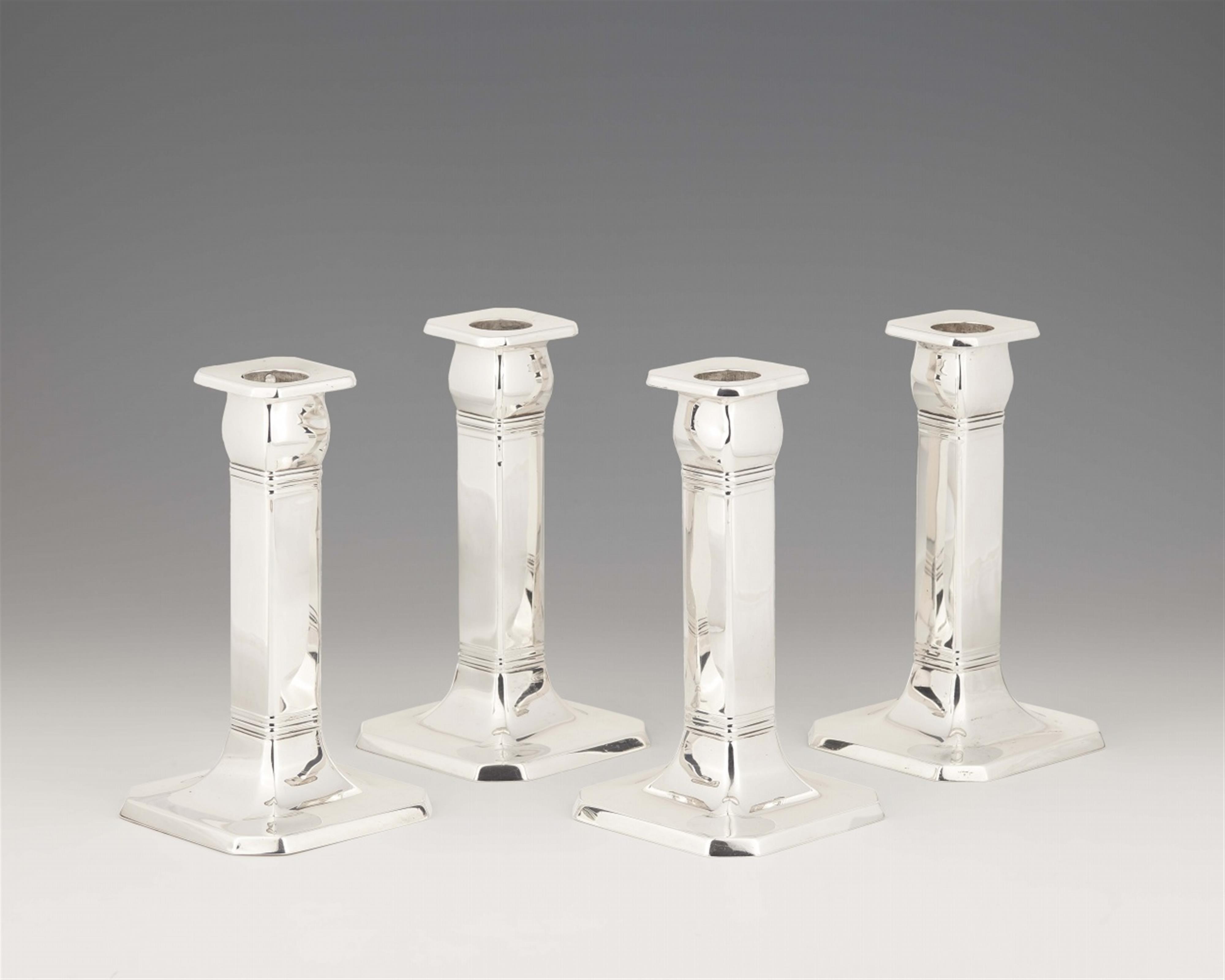 Four Tiffany silver candlesticks - 