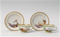 Apair of turquoise ground Meissen cups and saucers, the reserves painted with European landscapes. - image-1